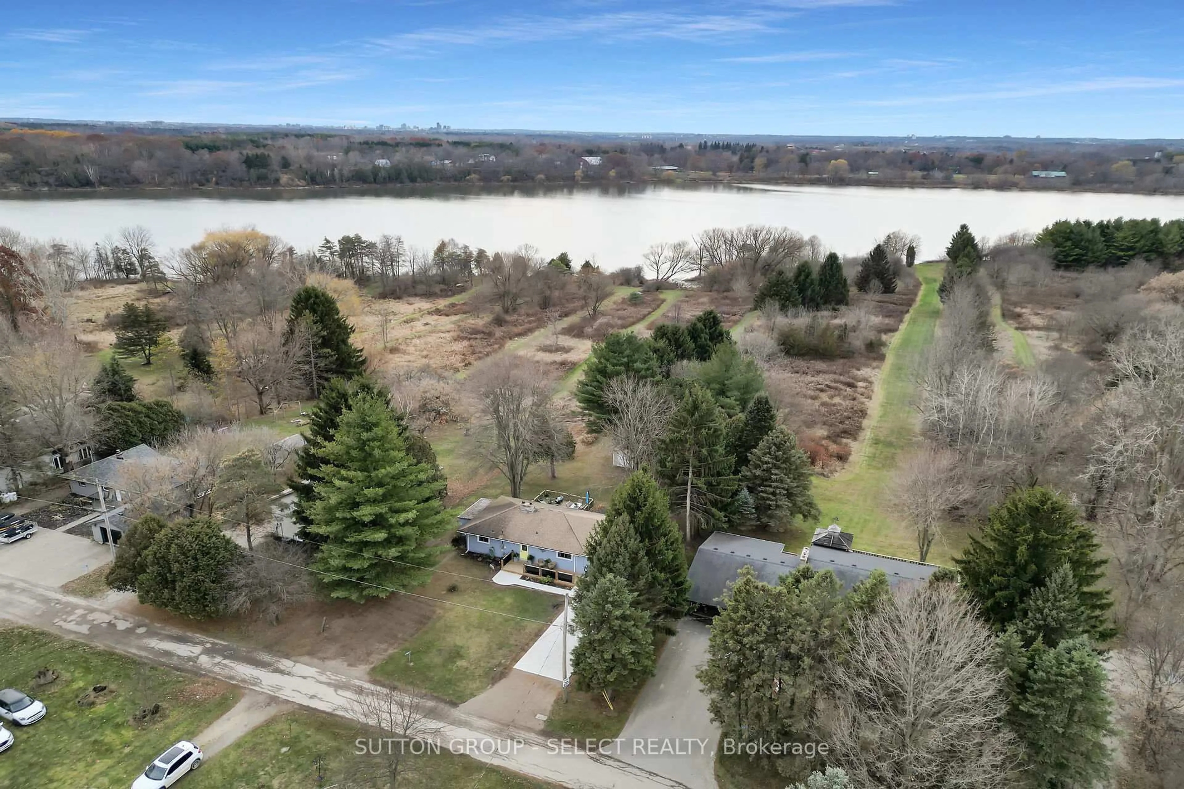 A pic from outside/outdoor area/front of a property/back of a property/a pic from drone, water/lake/river/ocean view for 21069 Riverview Dr, Thames Centre Ontario N0M 2P0