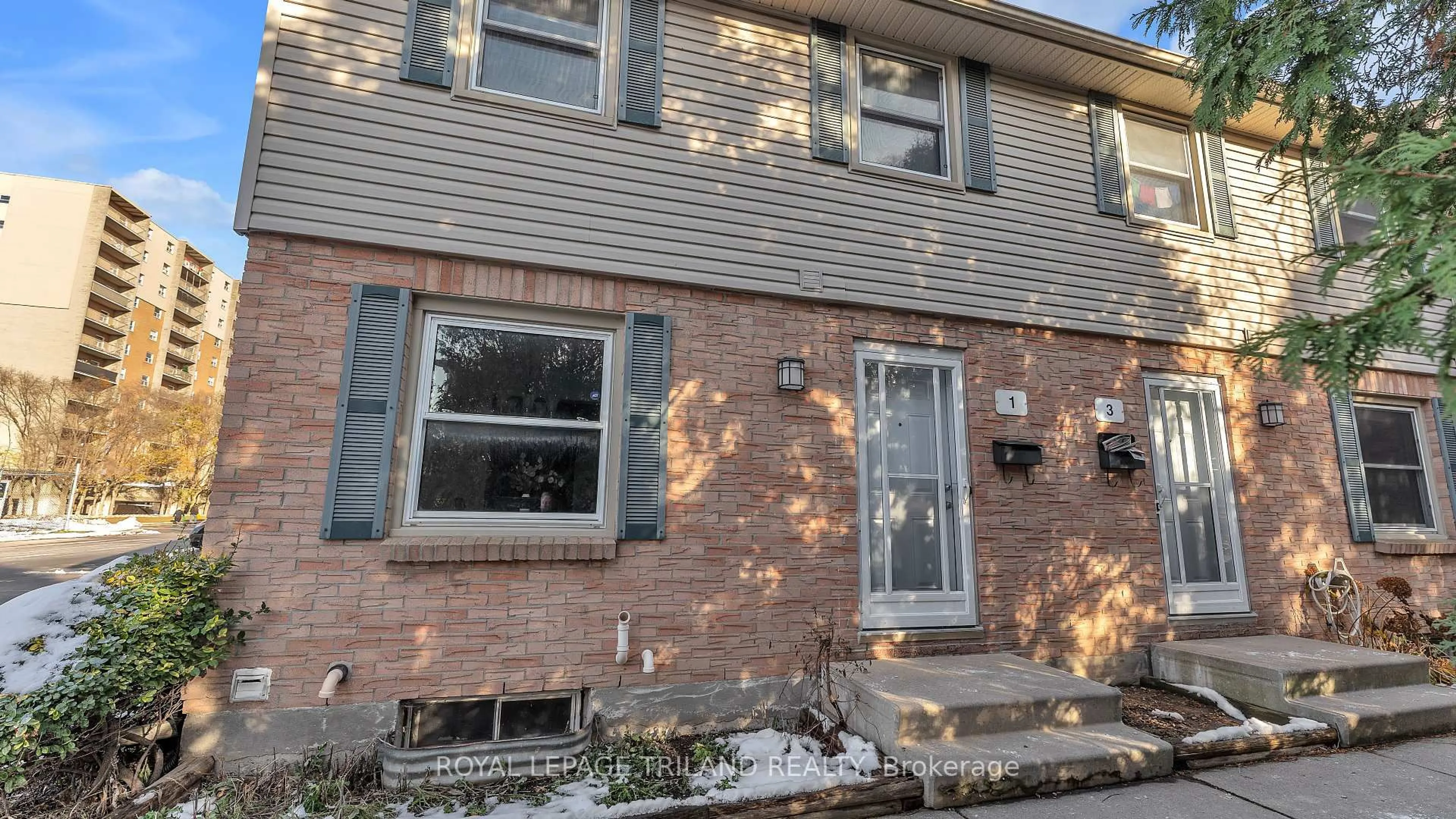 Home with brick exterior material, street for 1247 Huron St #1, London East Ontario N5Y 4X7