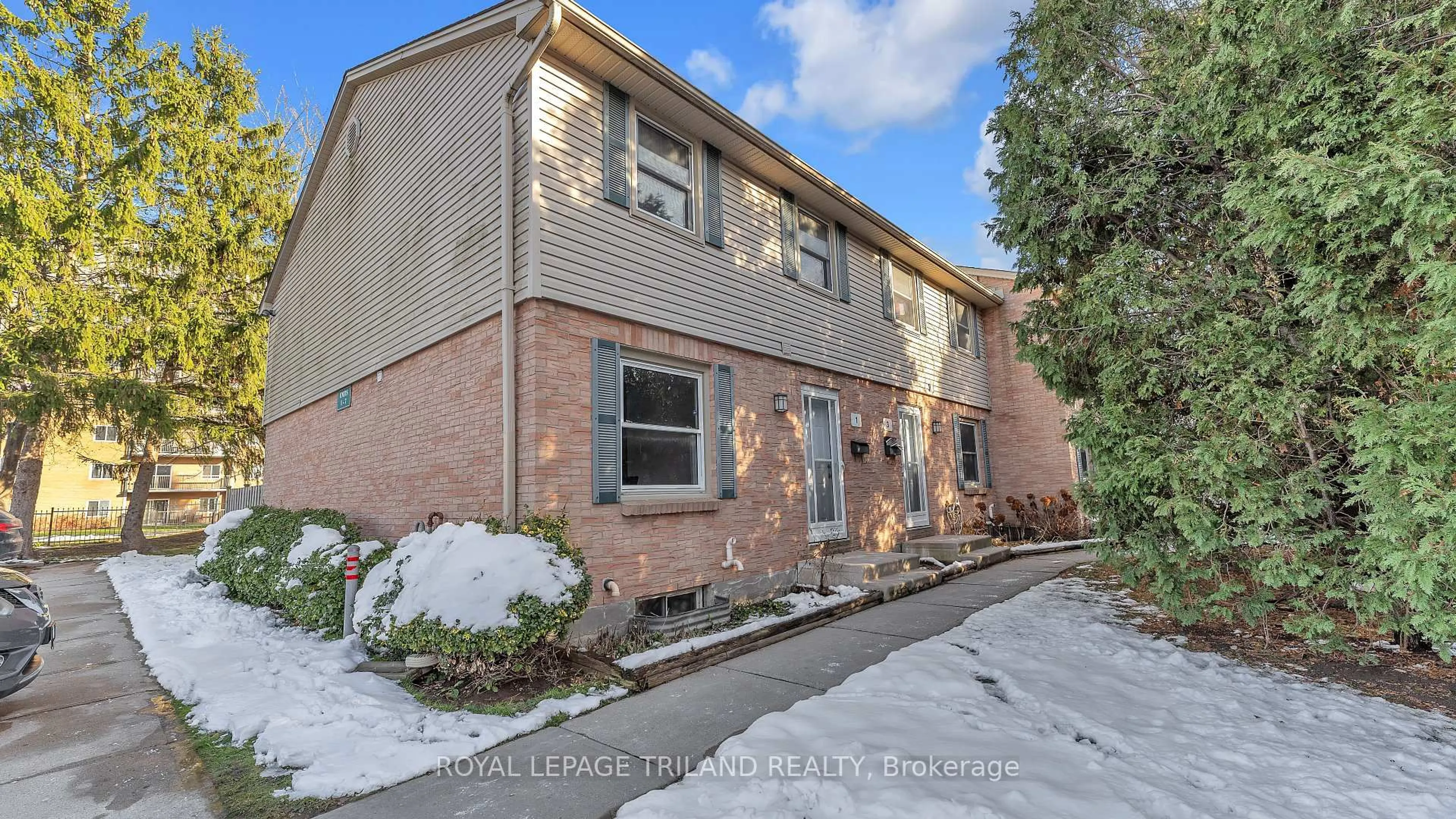Home with brick exterior material, street for 1247 Huron St #1, London East Ontario N5Y 4X7