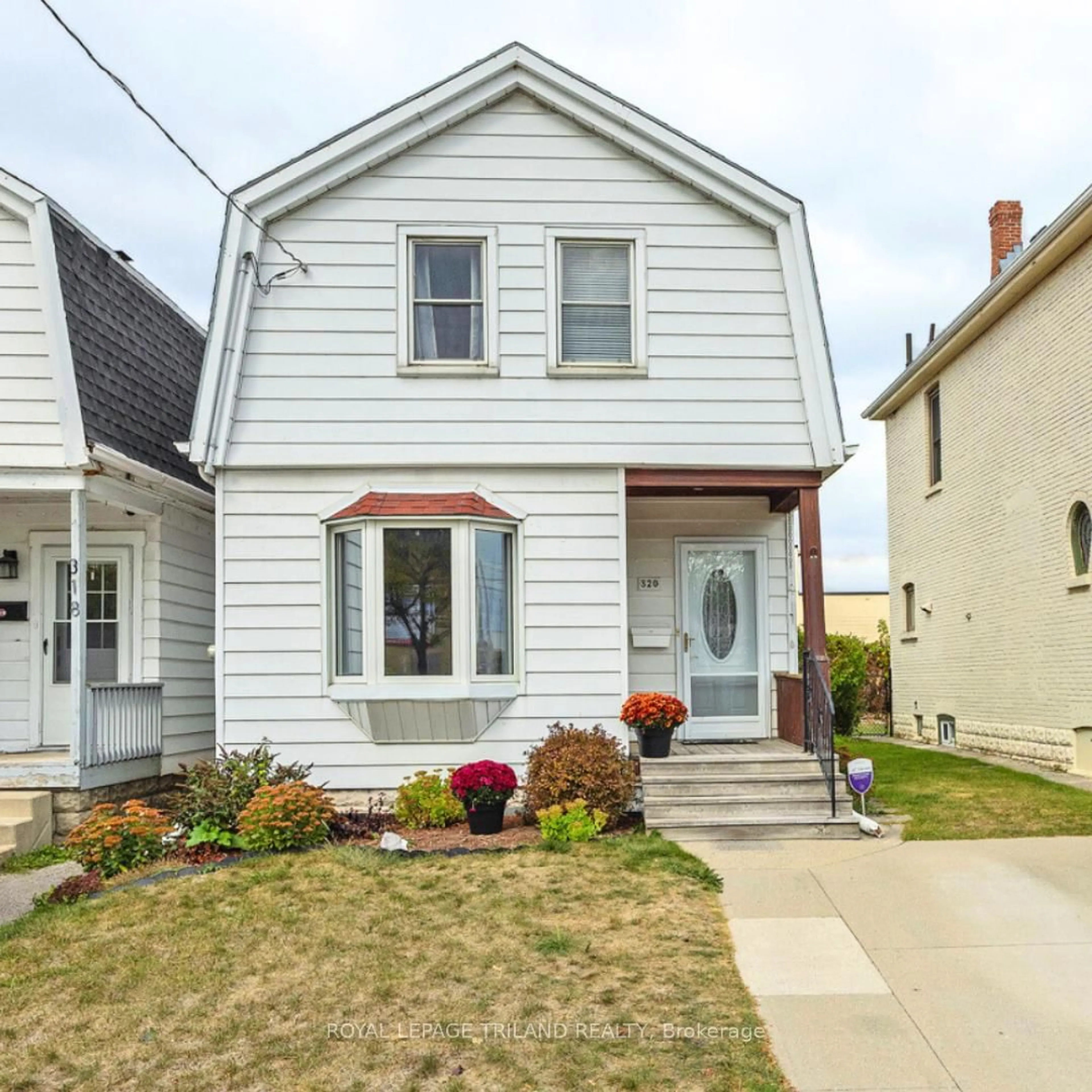 Home with vinyl exterior material, street for 320 Horton St, London East Ontario N6B 1L4