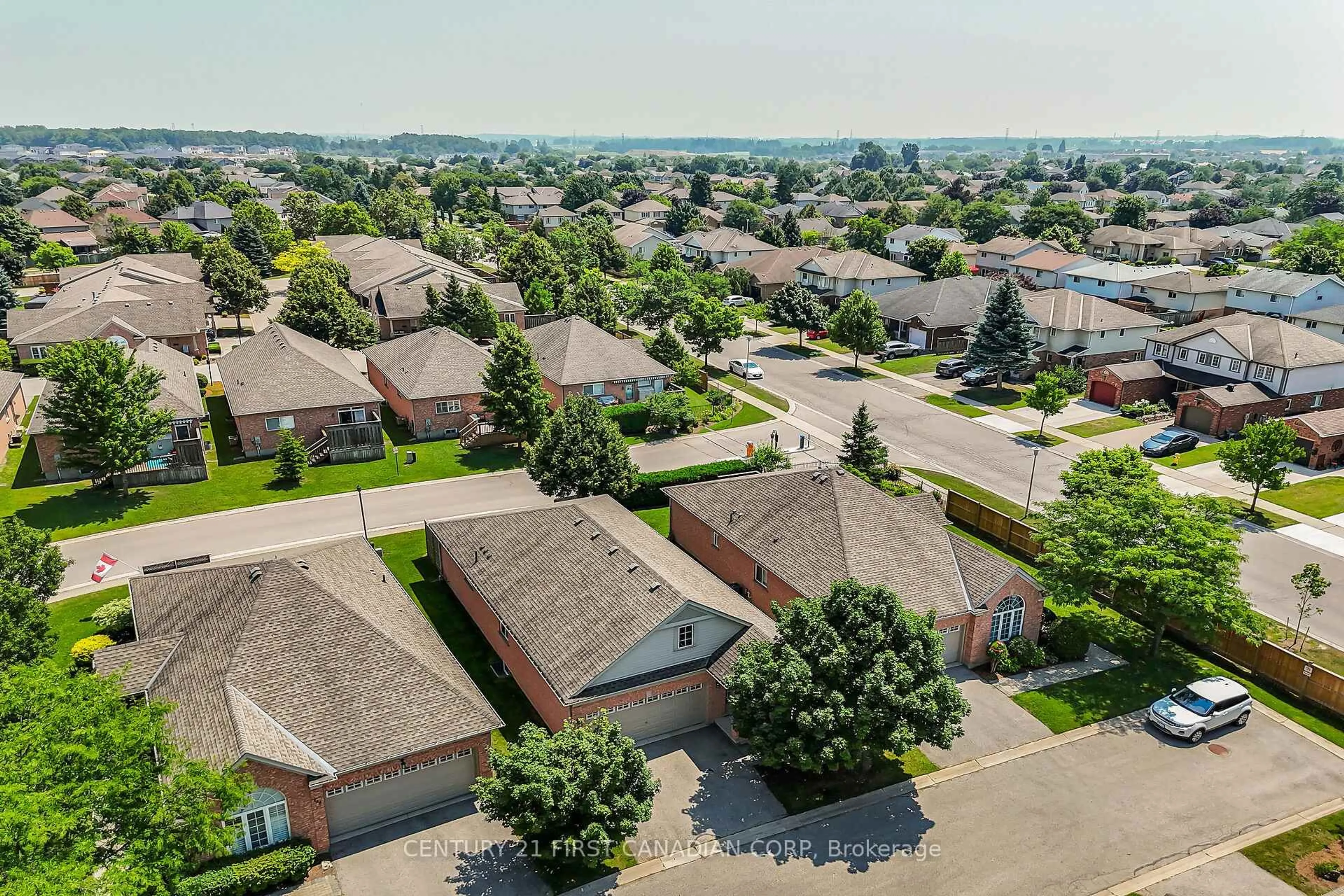 A pic from outside/outdoor area/front of a property/back of a property/a pic from drone, street for 2025 Meadowgate Blvd #153, London South Ontario N6M 1K9