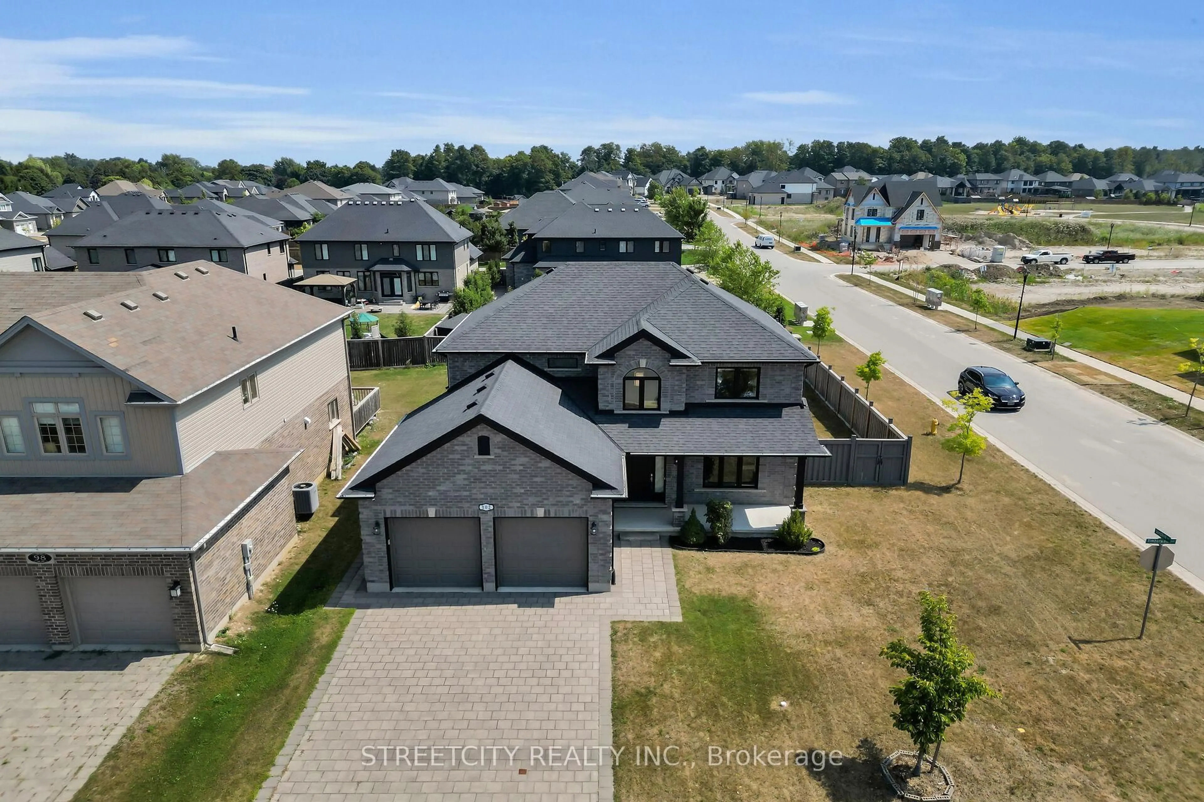 A pic from outside/outdoor area/front of a property/back of a property/a pic from drone, street for 102 Timberwalk Tr, Middlesex Centre Ontario N0M 2A0