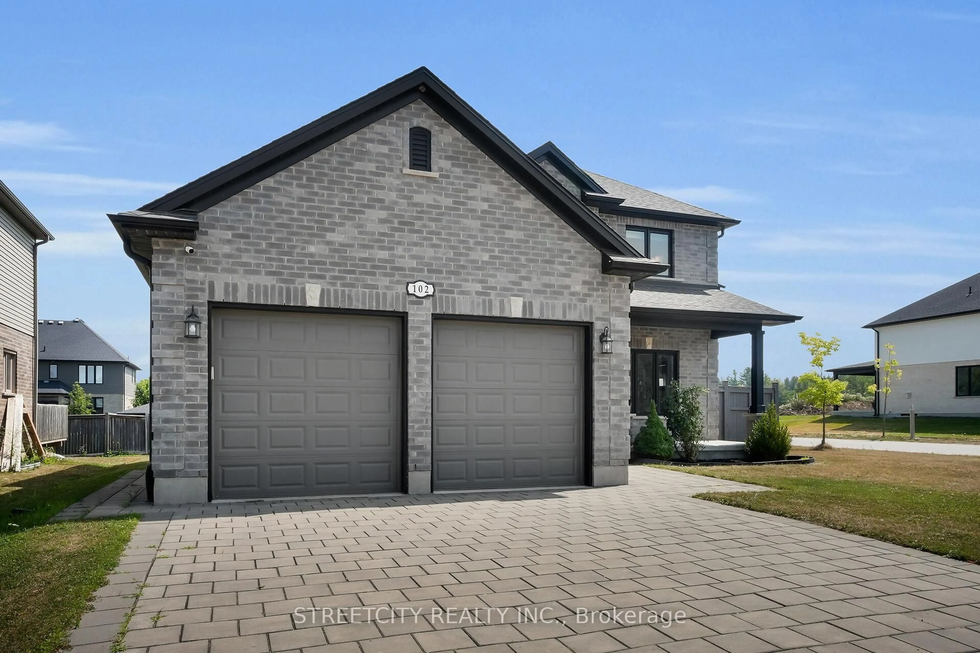 Home with brick exterior material, street for 102 Timberwalk Tr, Middlesex Centre Ontario N0M 2A0