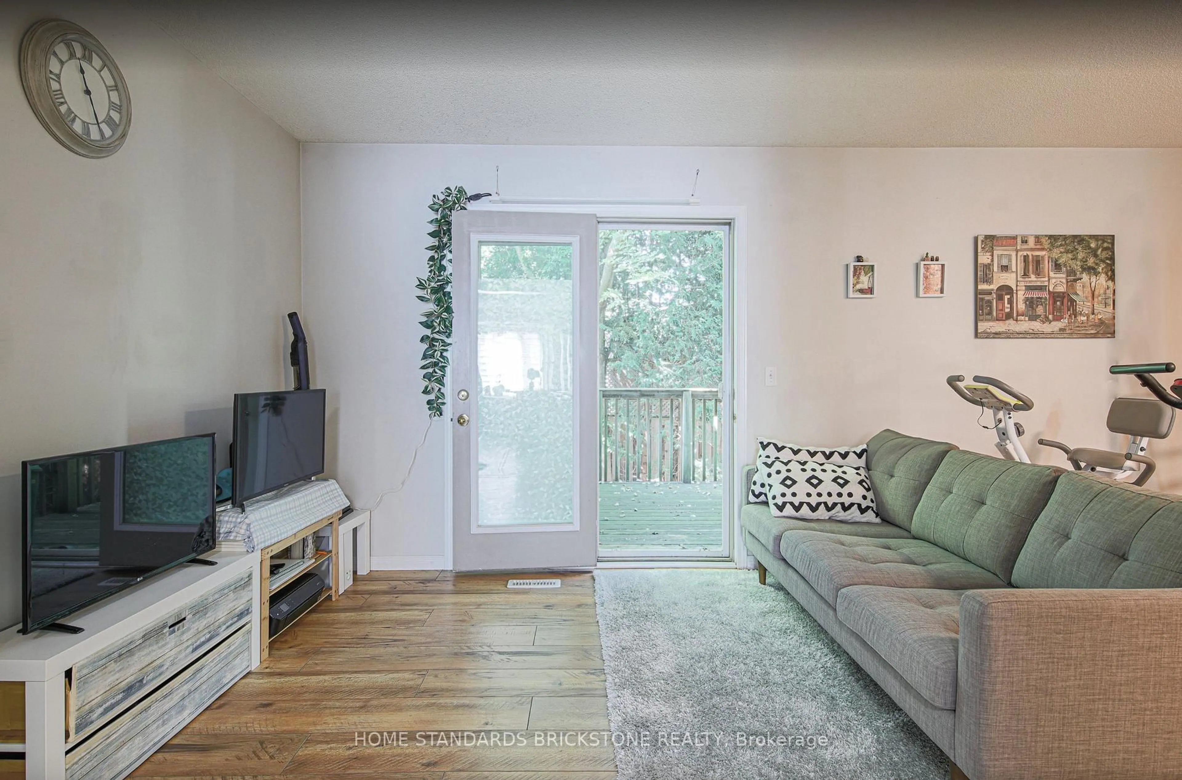 Living room with furniture, wood/laminate floor for 1320 Savannah Dr #80, London North Ontario N5X 0B7