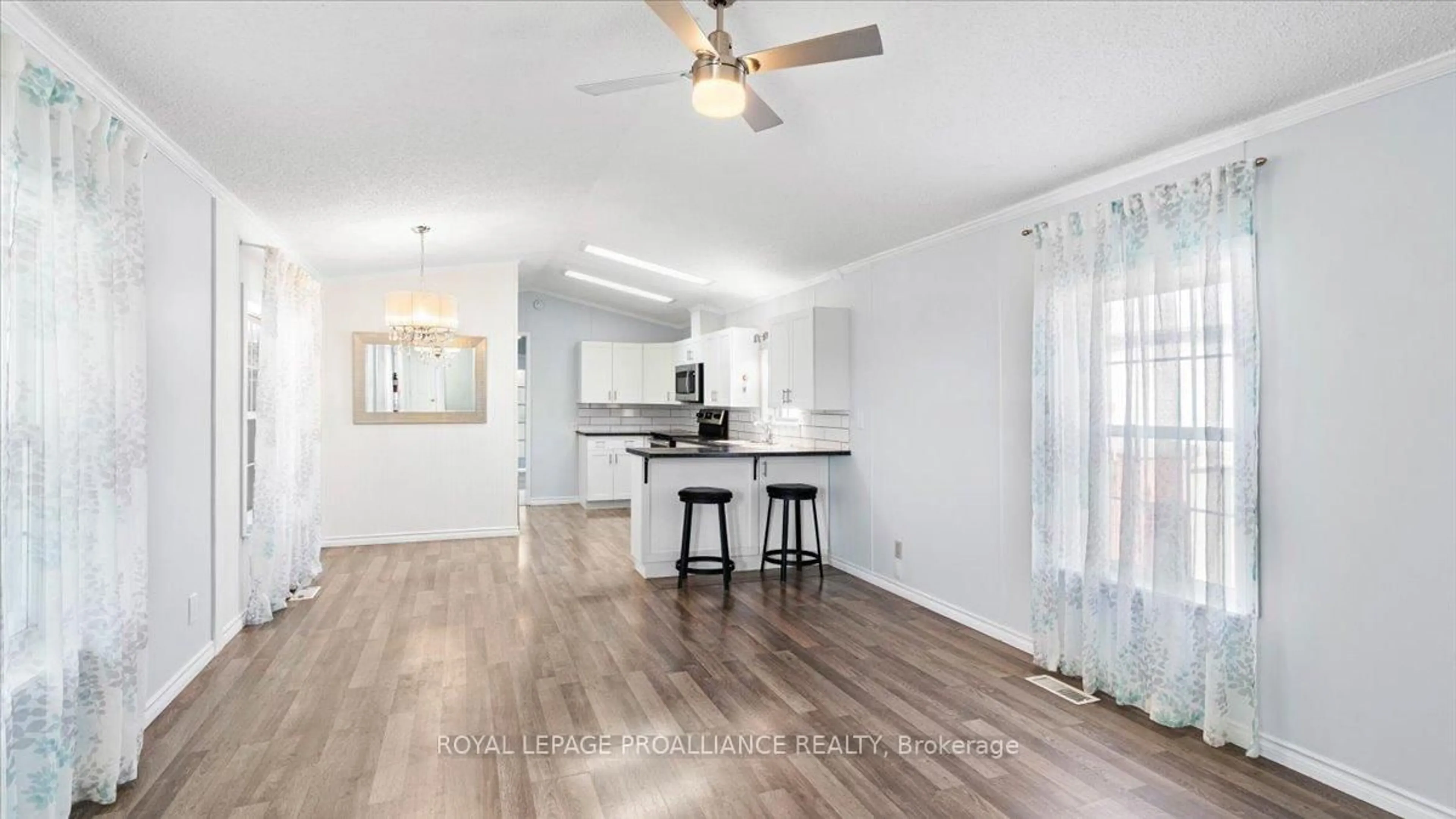 Open concept kitchen, wood/laminate floor for 311 Dundas St #18, Quinte West Ontario K8V 1M1