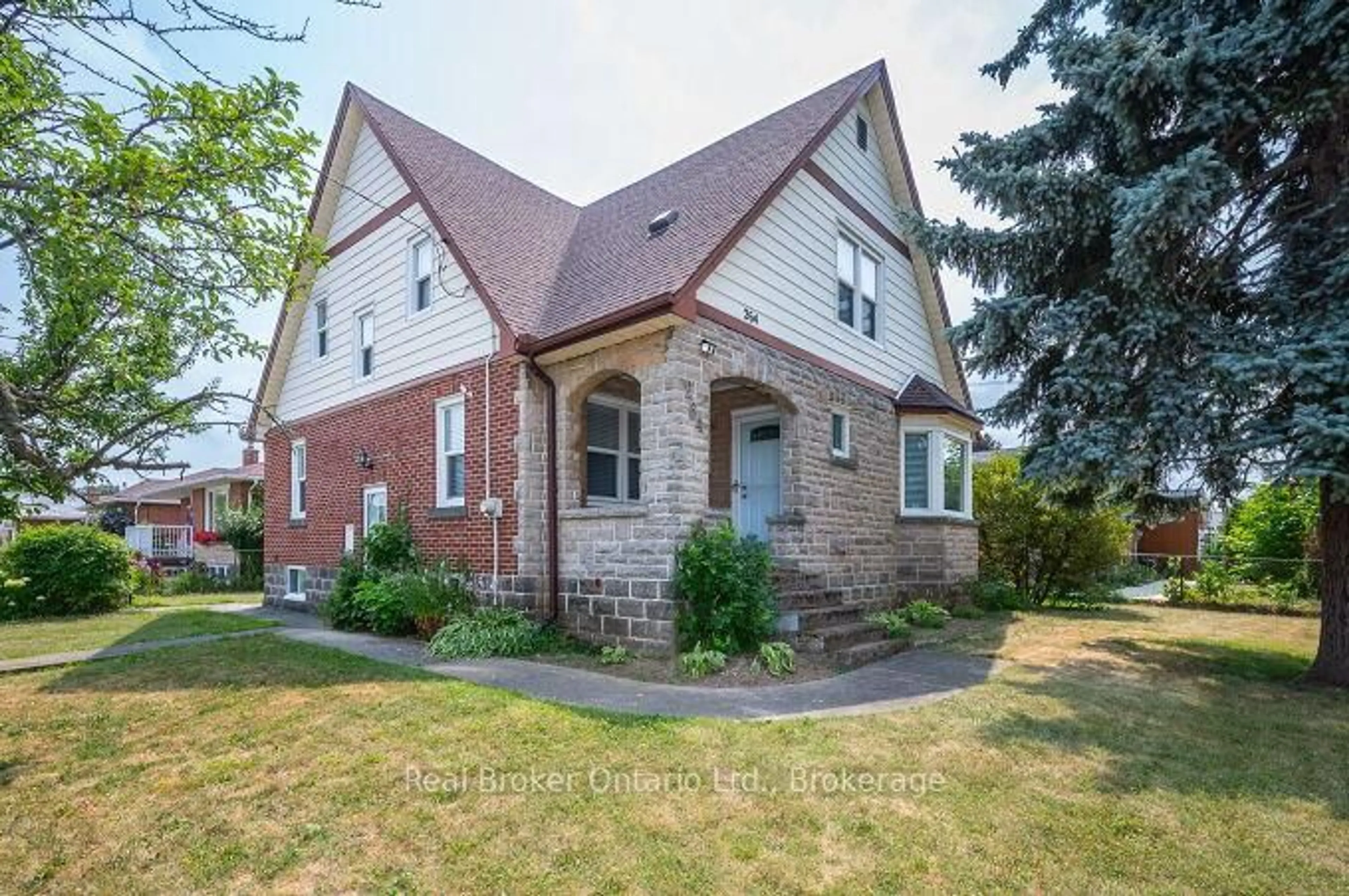 Home with brick exterior material, street for 264 Grays Rd, Hamilton Ontario L8E 1V1