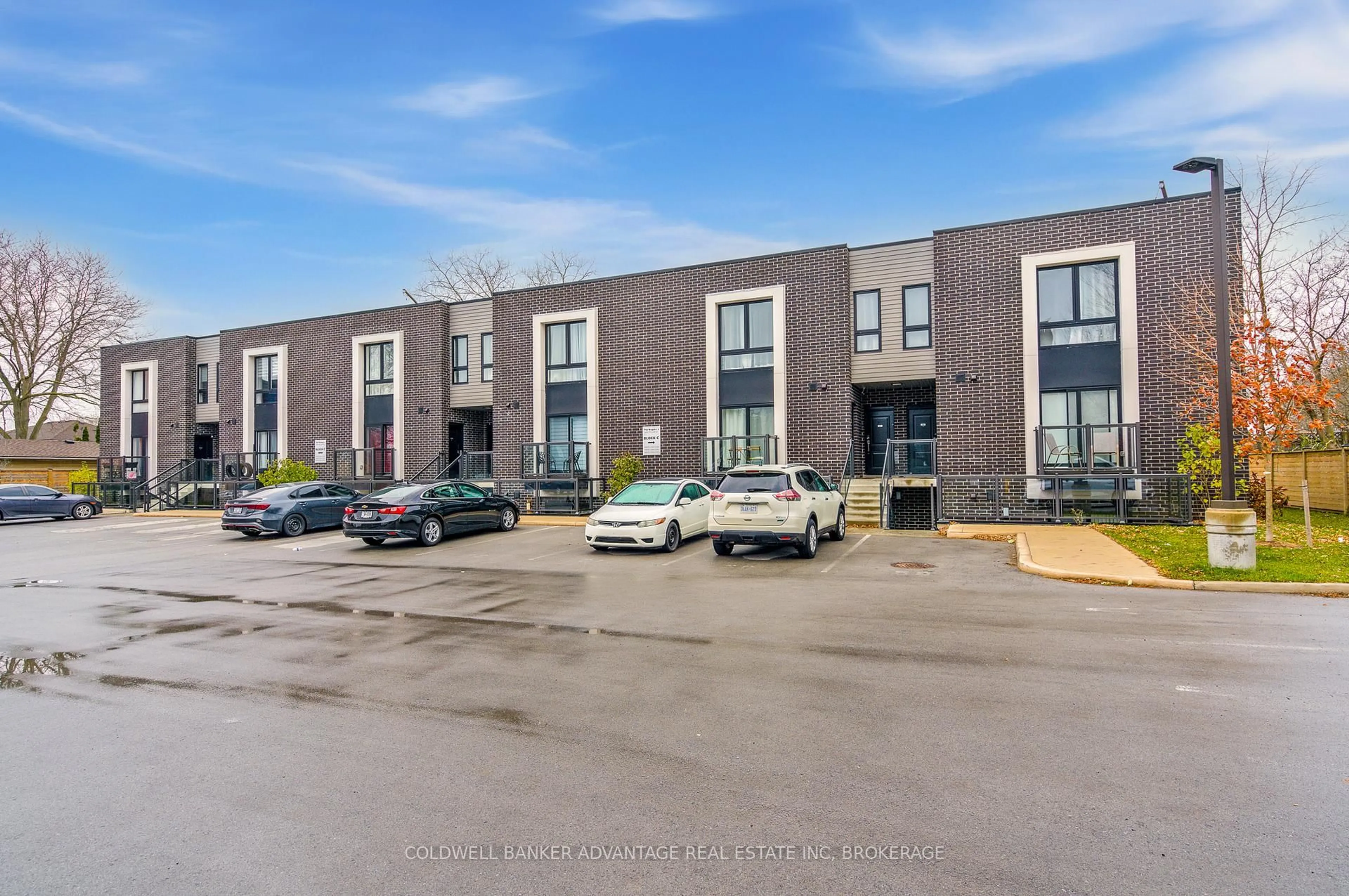 A pic from outside/outdoor area/front of a property/back of a property/a pic from drone, street for 6065 McLeod Rd #103, Niagara Falls Ontario L2G 0Z7