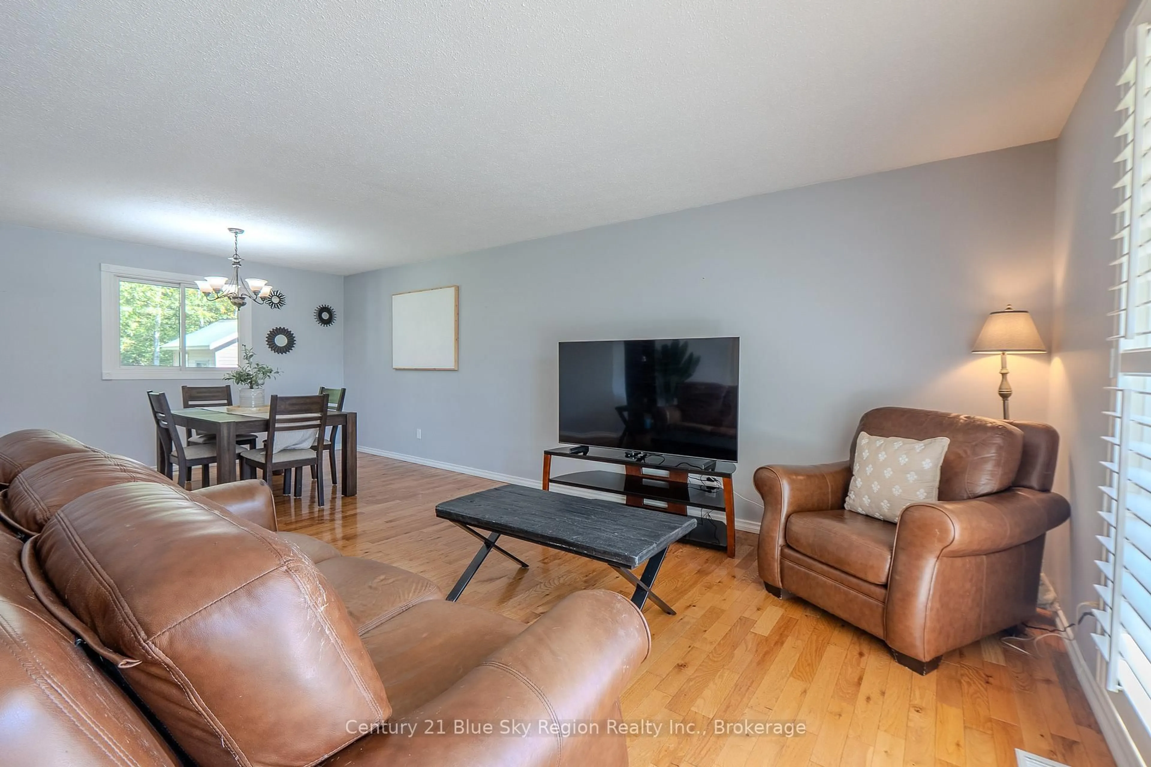 Living room with furniture, wood/laminate floor for 298 Rancier St, North Bay Ontario P1B 8M4