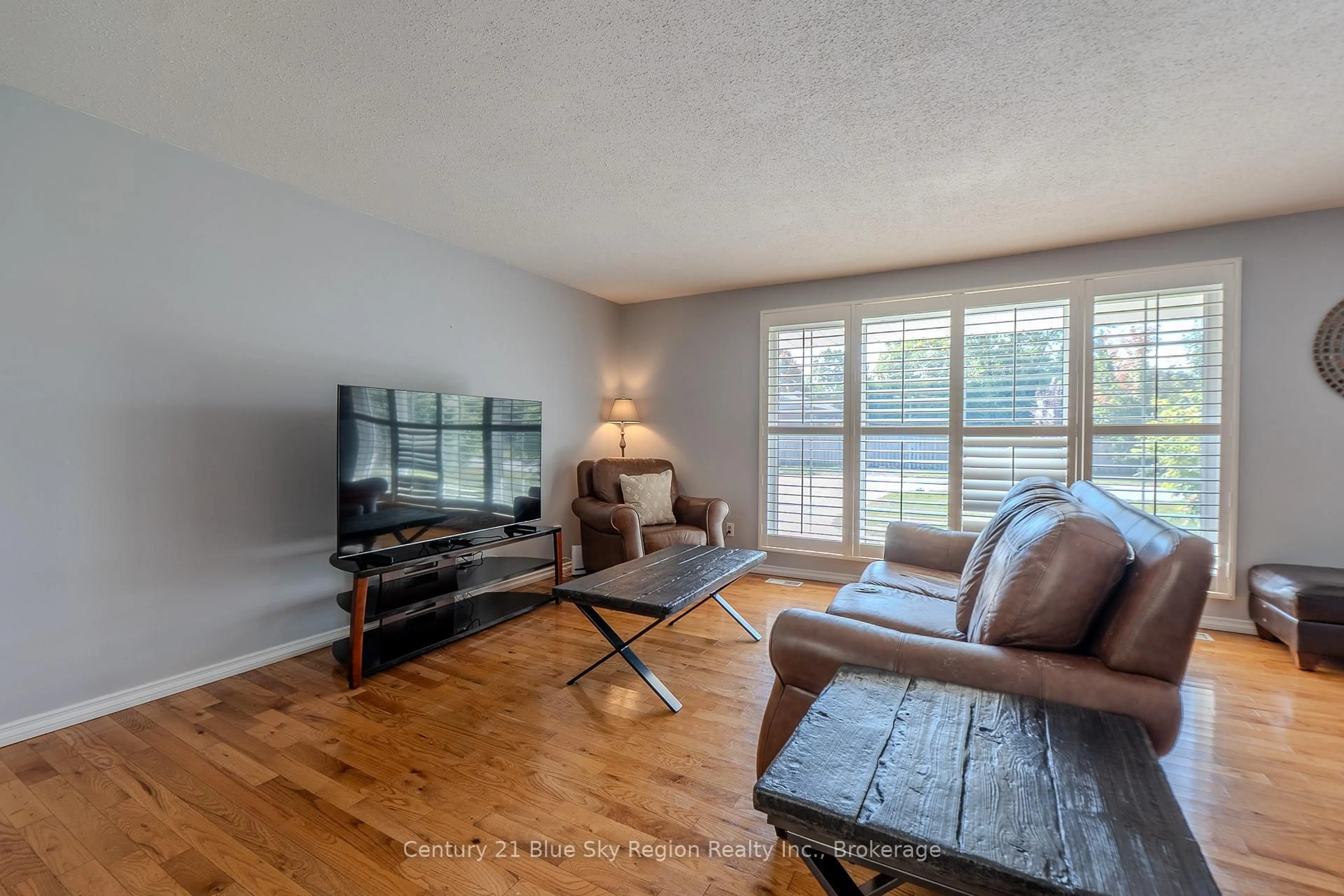 Living room with furniture, wood/laminate floor for 298 Rancier St, North Bay Ontario P1B 8M4