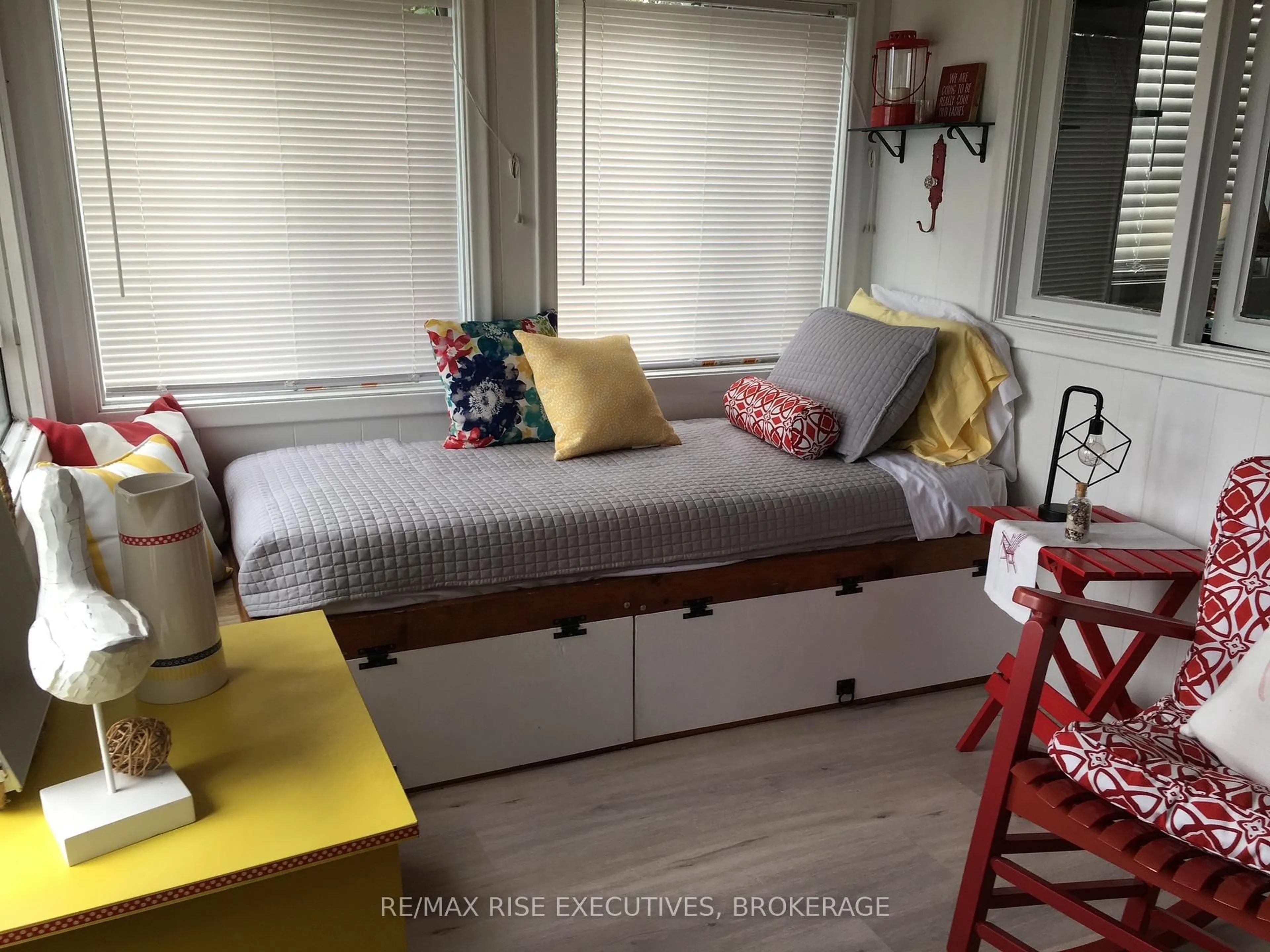 Bedroom with bed, wood/laminate floor for 5065 Lower Round Lake Rd, Battersea Ontario K0H 1H0