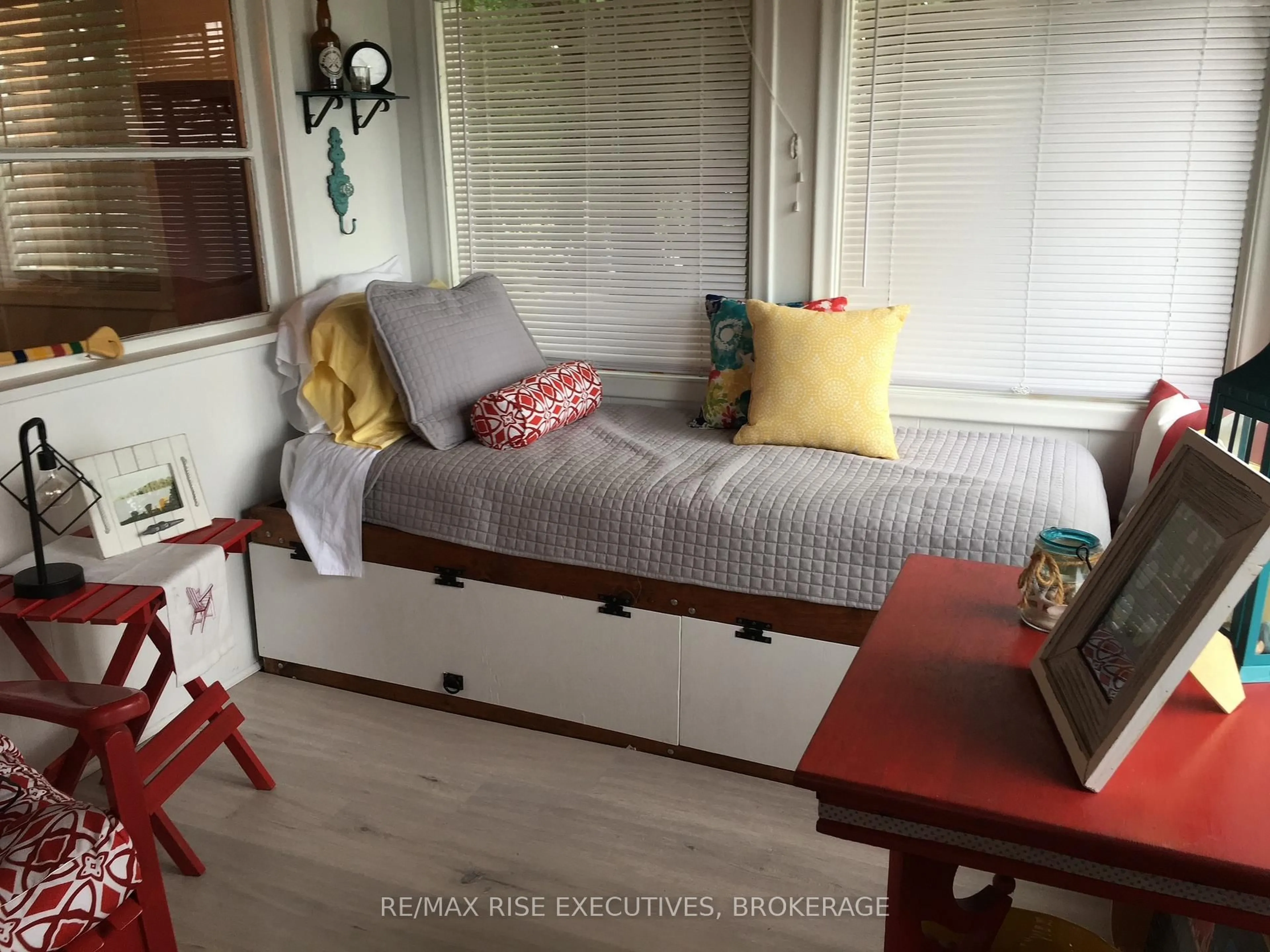 Bedroom with bed, wood/laminate floor for 5065 Lower Round Lake Rd, Battersea Ontario K0H 1H0