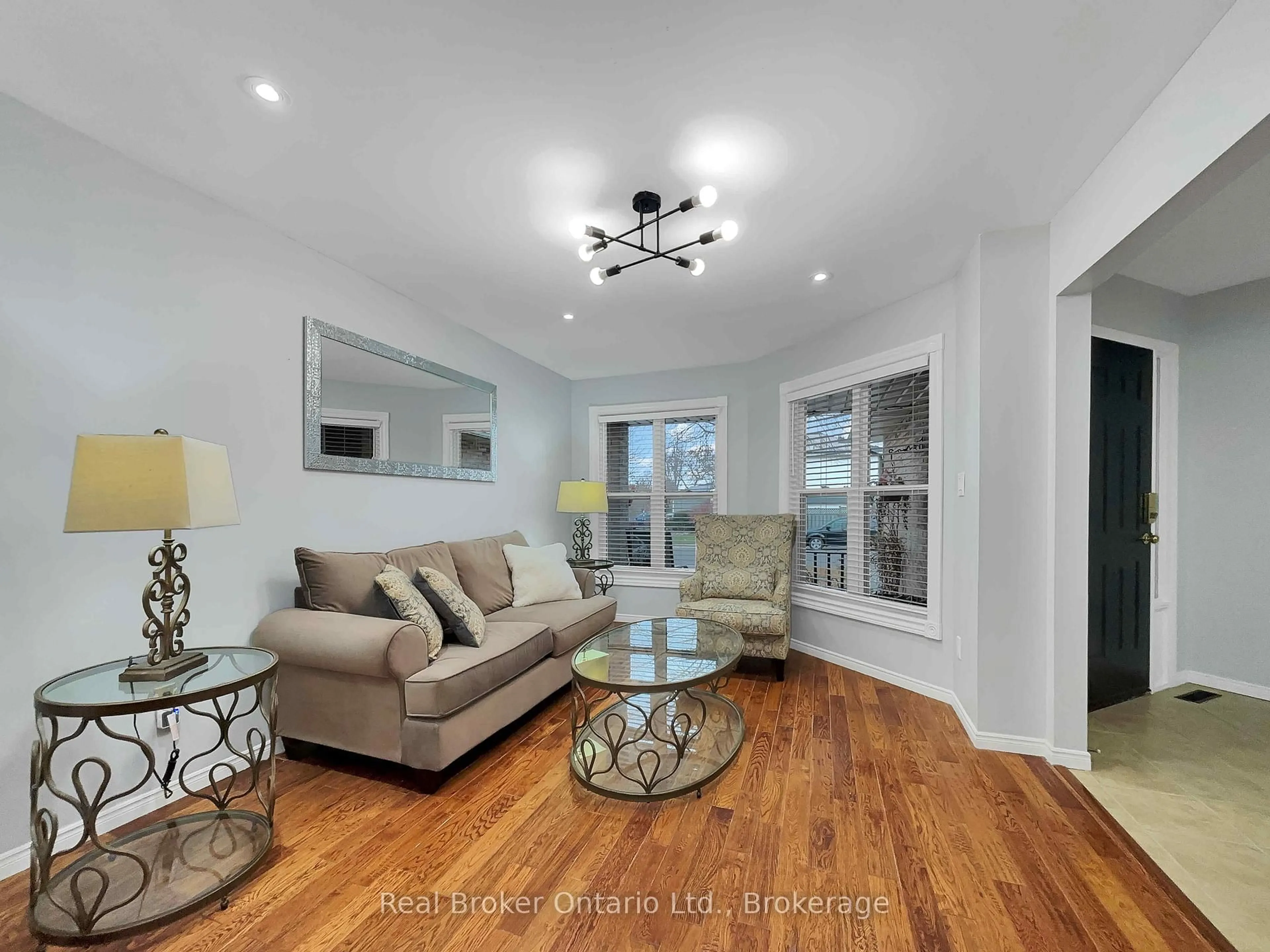 Living room with furniture, wood/laminate floor for 157 Twin Cres, Hamilton Ontario L8W 3A7