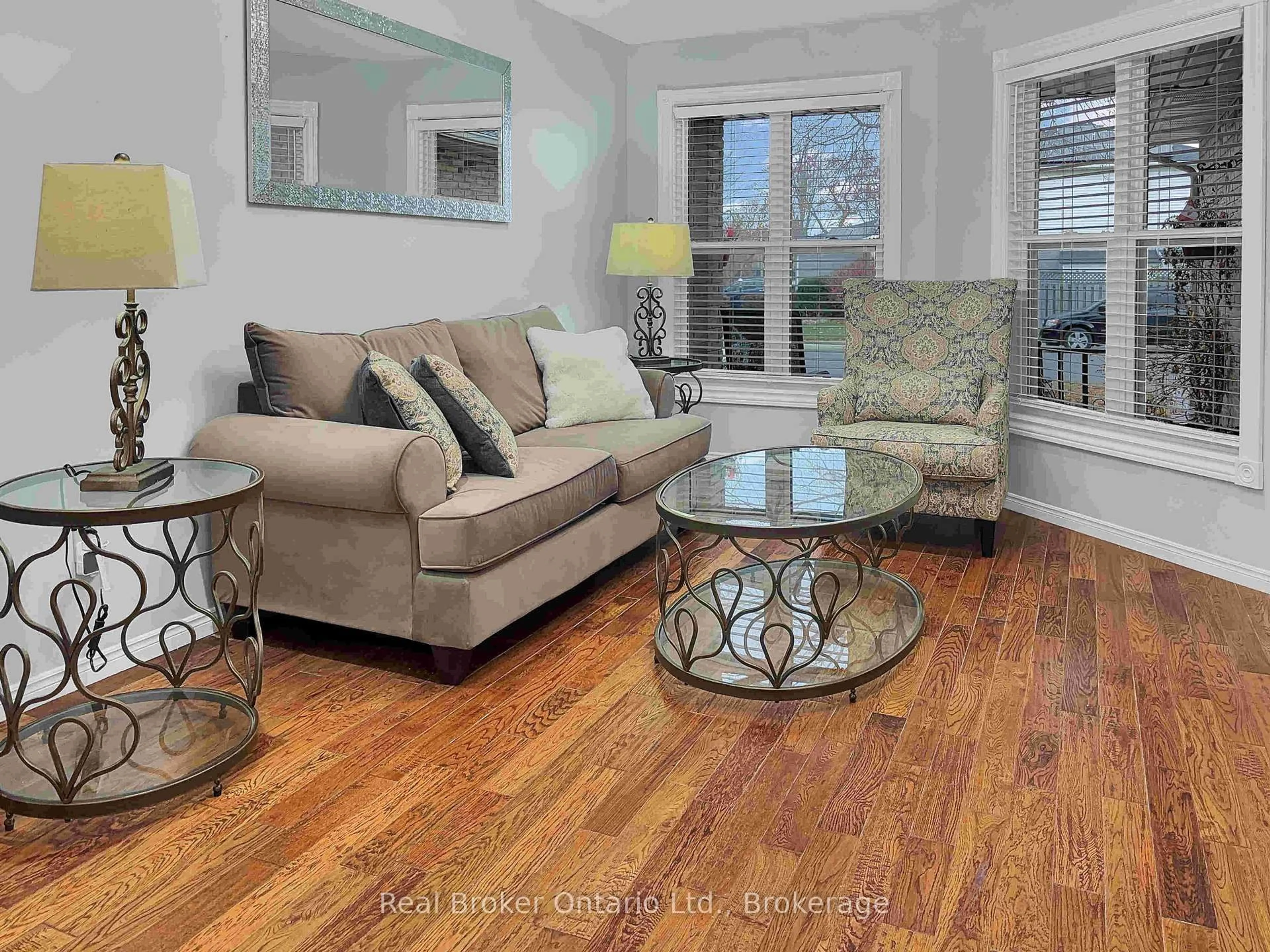 Living room with furniture, wood/laminate floor for 157 Twin Cres, Hamilton Ontario L8W 3A7