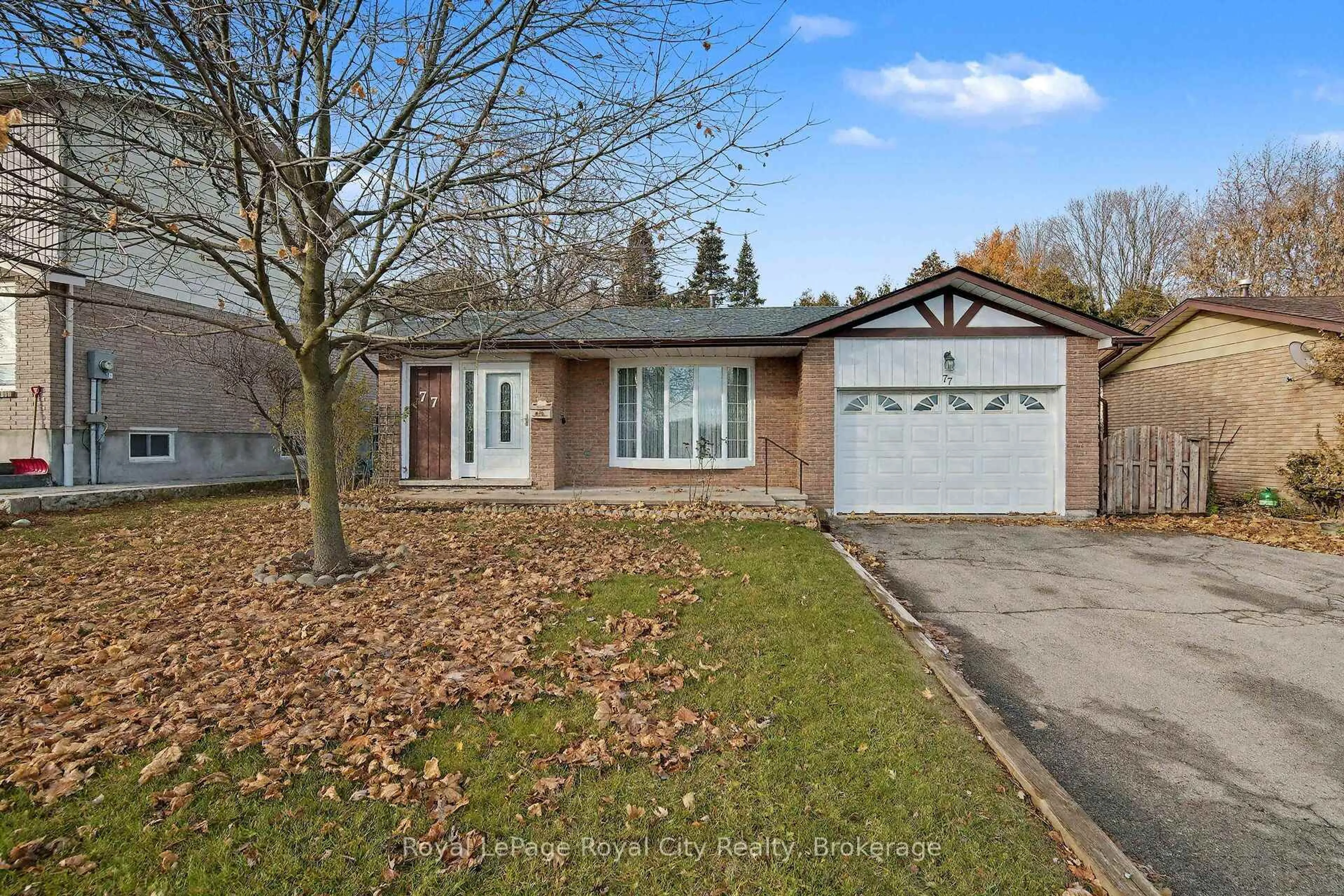 Home with brick exterior material, street for 77 Kortright Rd, Guelph Ontario N1G 3B3