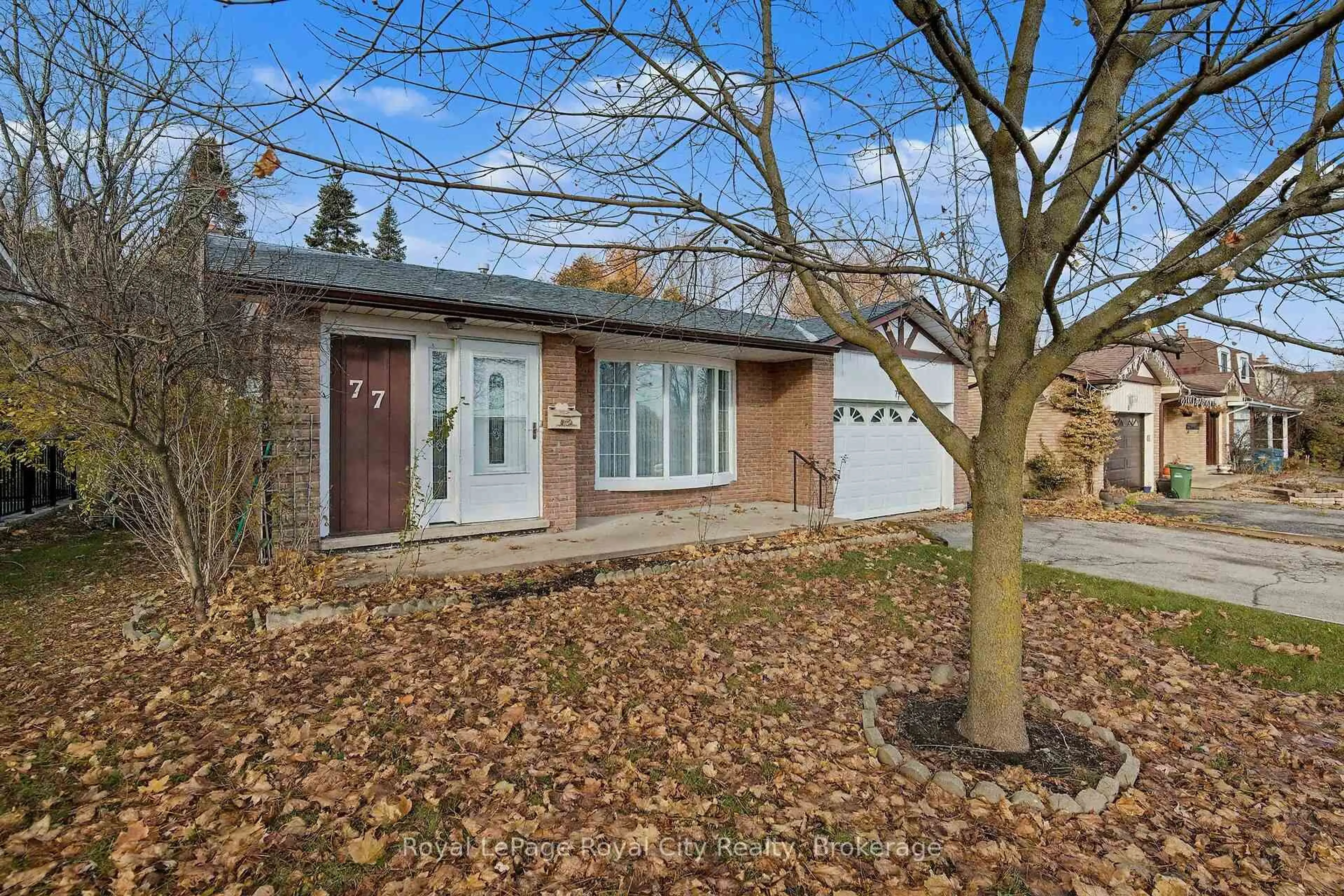 Home with brick exterior material, street for 77 Kortright Rd, Guelph Ontario N1G 3B3