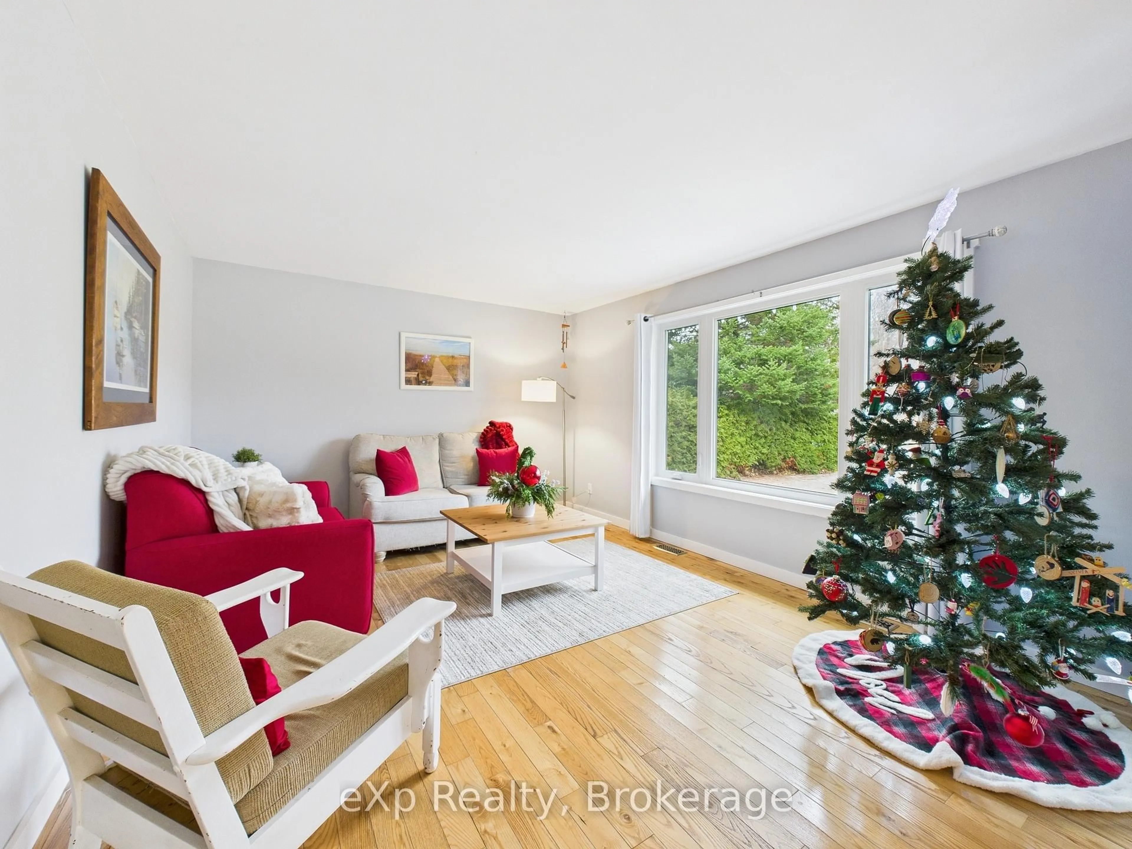 Living room with furniture, wood/laminate floor for 568 McNabb St, Saugeen Shores Ontario N0H 2L0