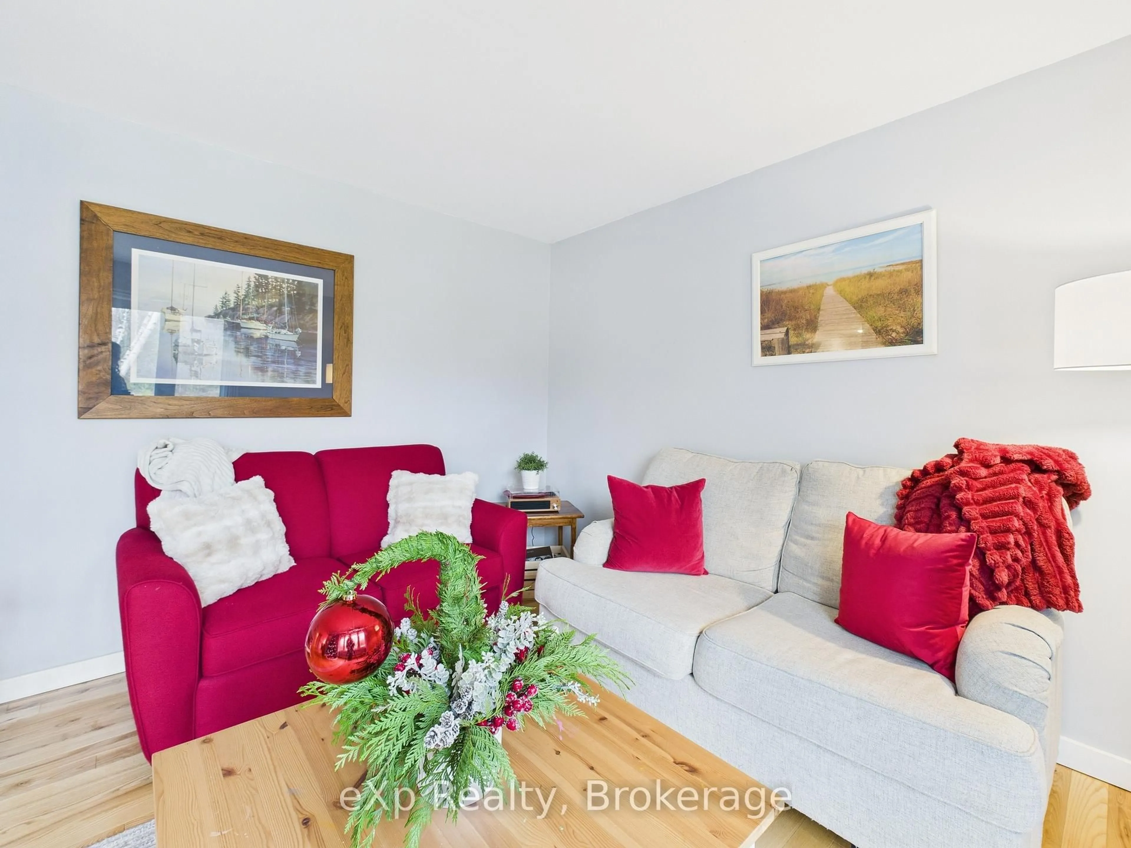 Living room with furniture, wood/laminate floor for 568 McNabb St, Saugeen Shores Ontario N0H 2L0