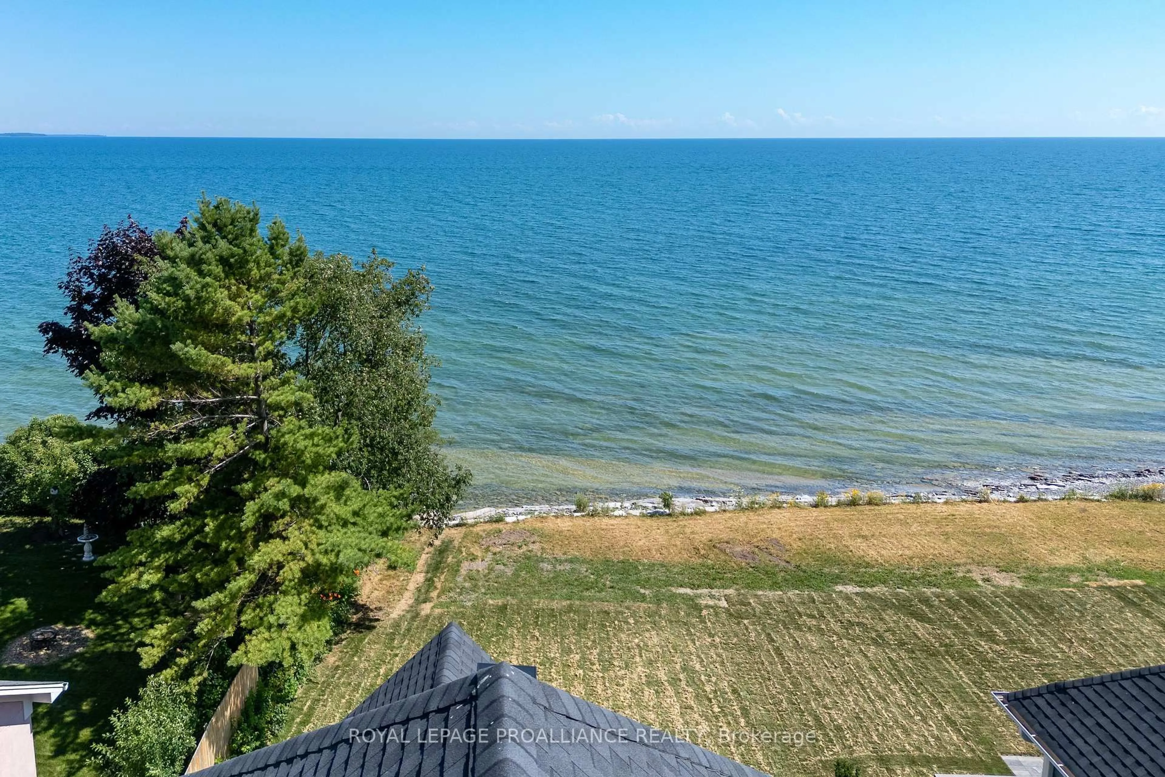 A pic from outside/outdoor area/front of a property/back of a property/a pic from drone, water/lake/river/ocean view for 16 Twelve Trees Crt, Prince Edward County Ontario K0K 3L0