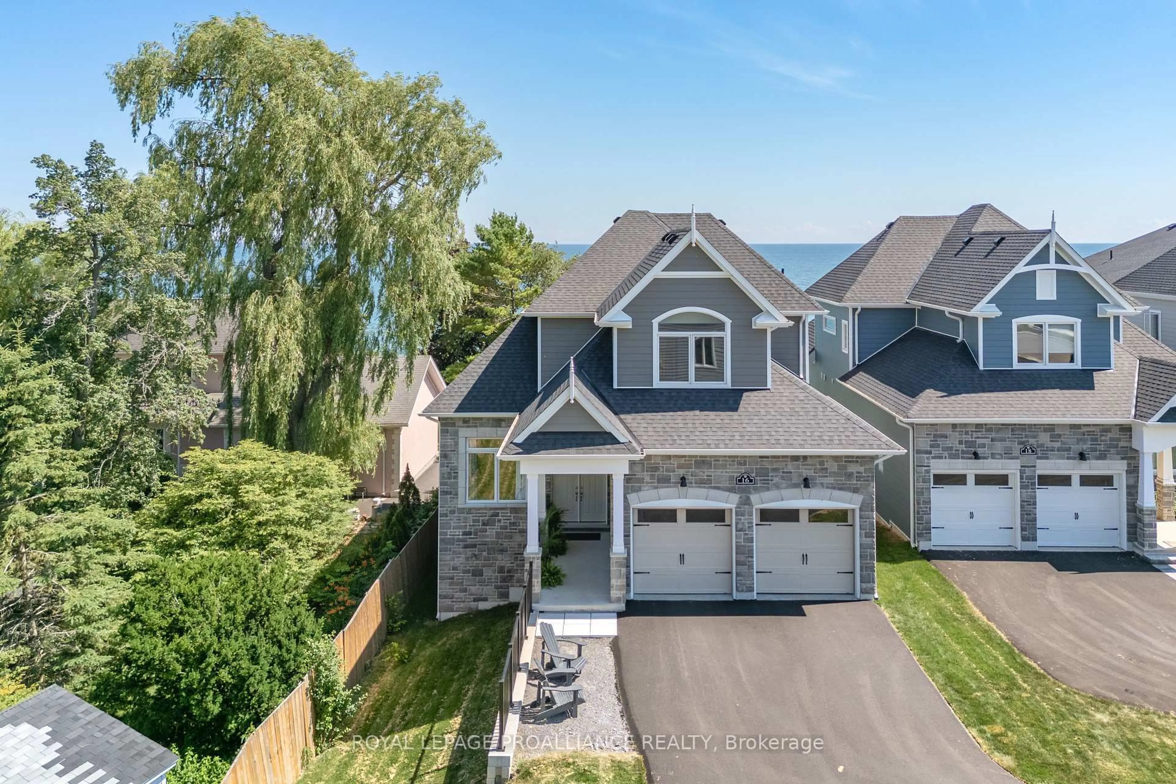 A pic from outside/outdoor area/front of a property/back of a property/a pic from drone, street for 16 Twelve Trees Crt, Prince Edward County Ontario K0K 3L0