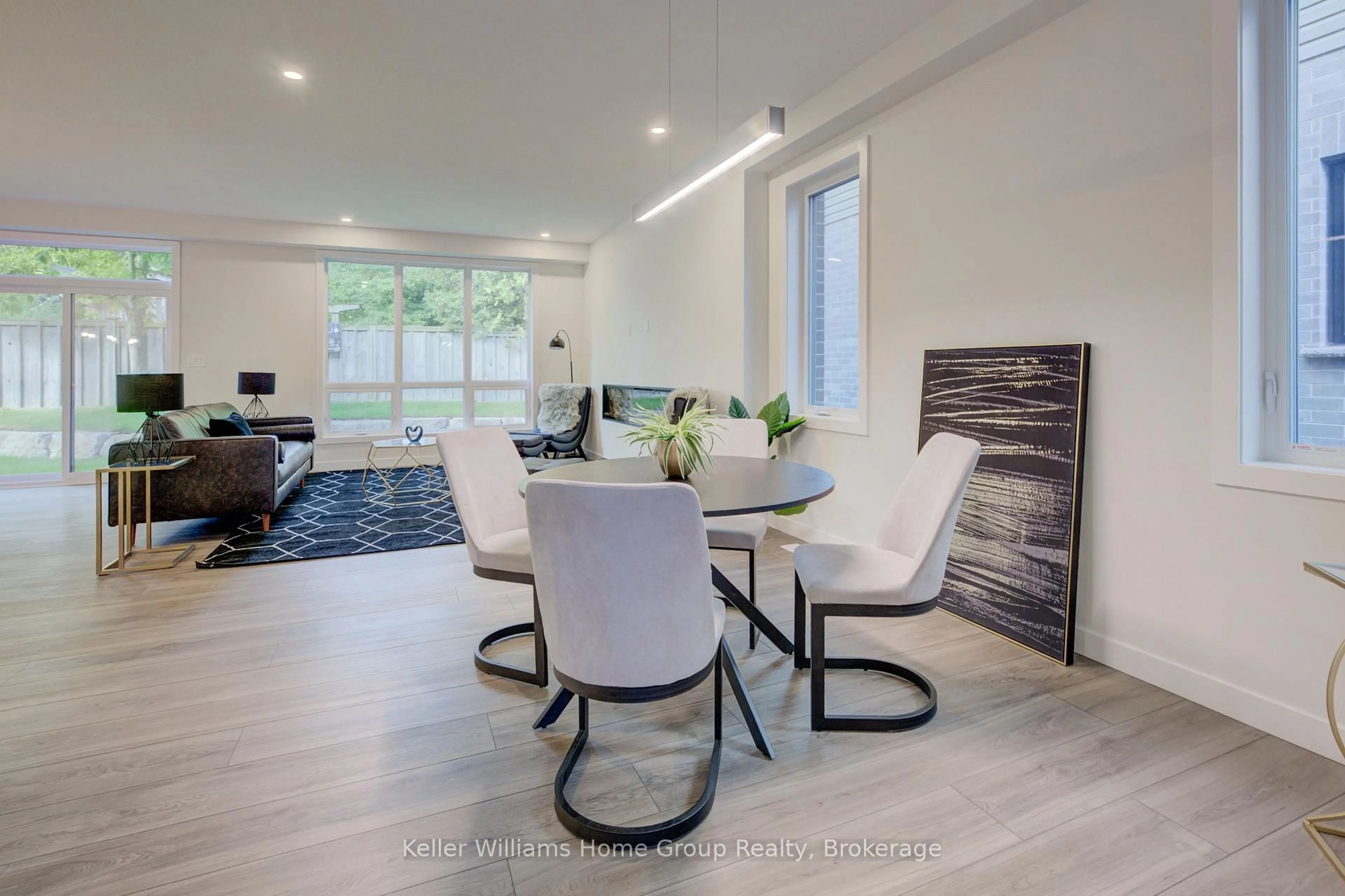 Dining room, wood/laminate floor for 16 Nicholas Way, Guelph Ontario N1E 0T1
