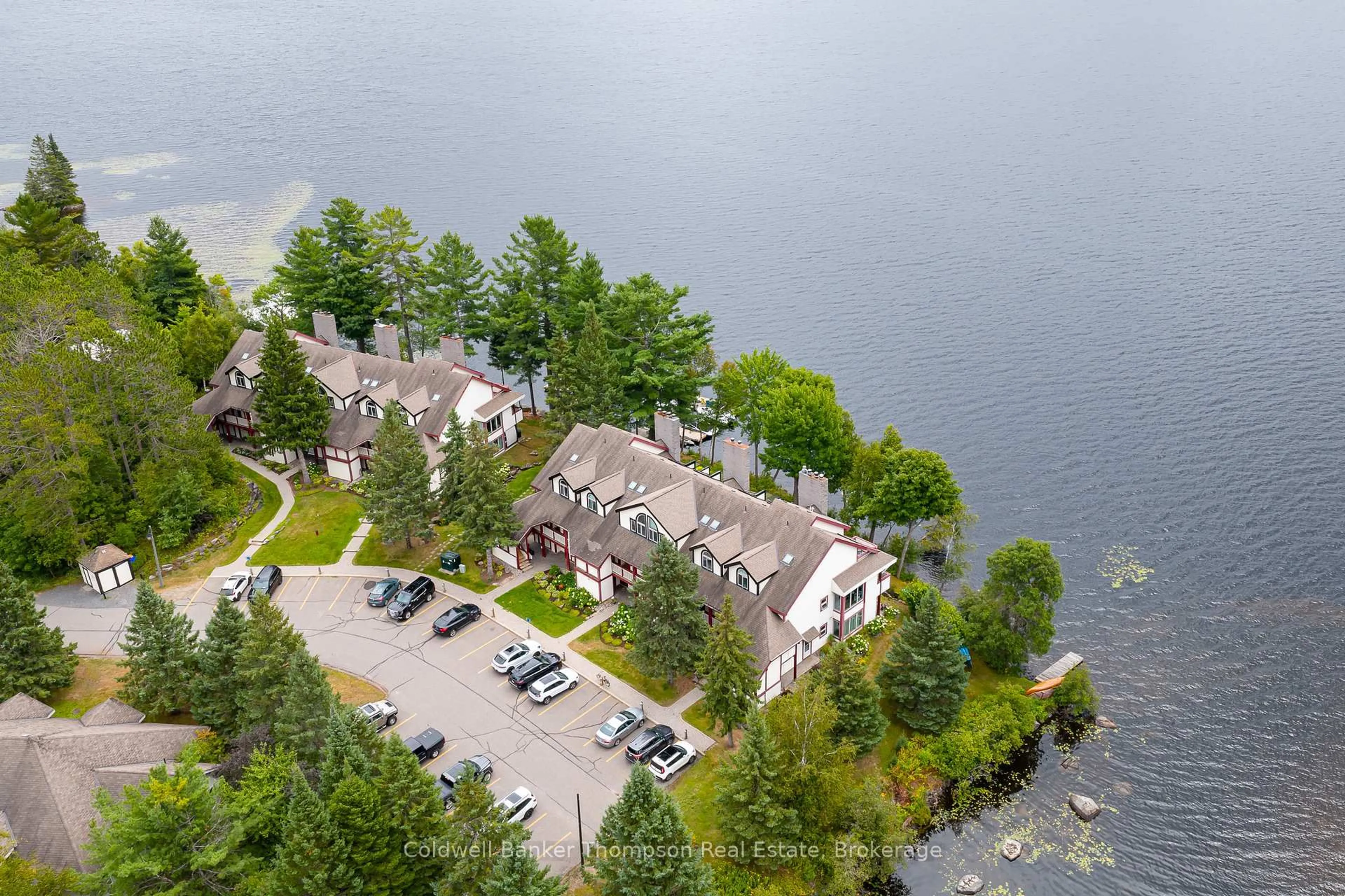 A pic from outside/outdoor area/front of a property/back of a property/a pic from drone, water/lake/river/ocean view for 10 Coveside Dr #204, Huntsville Ontario P1H 1C3