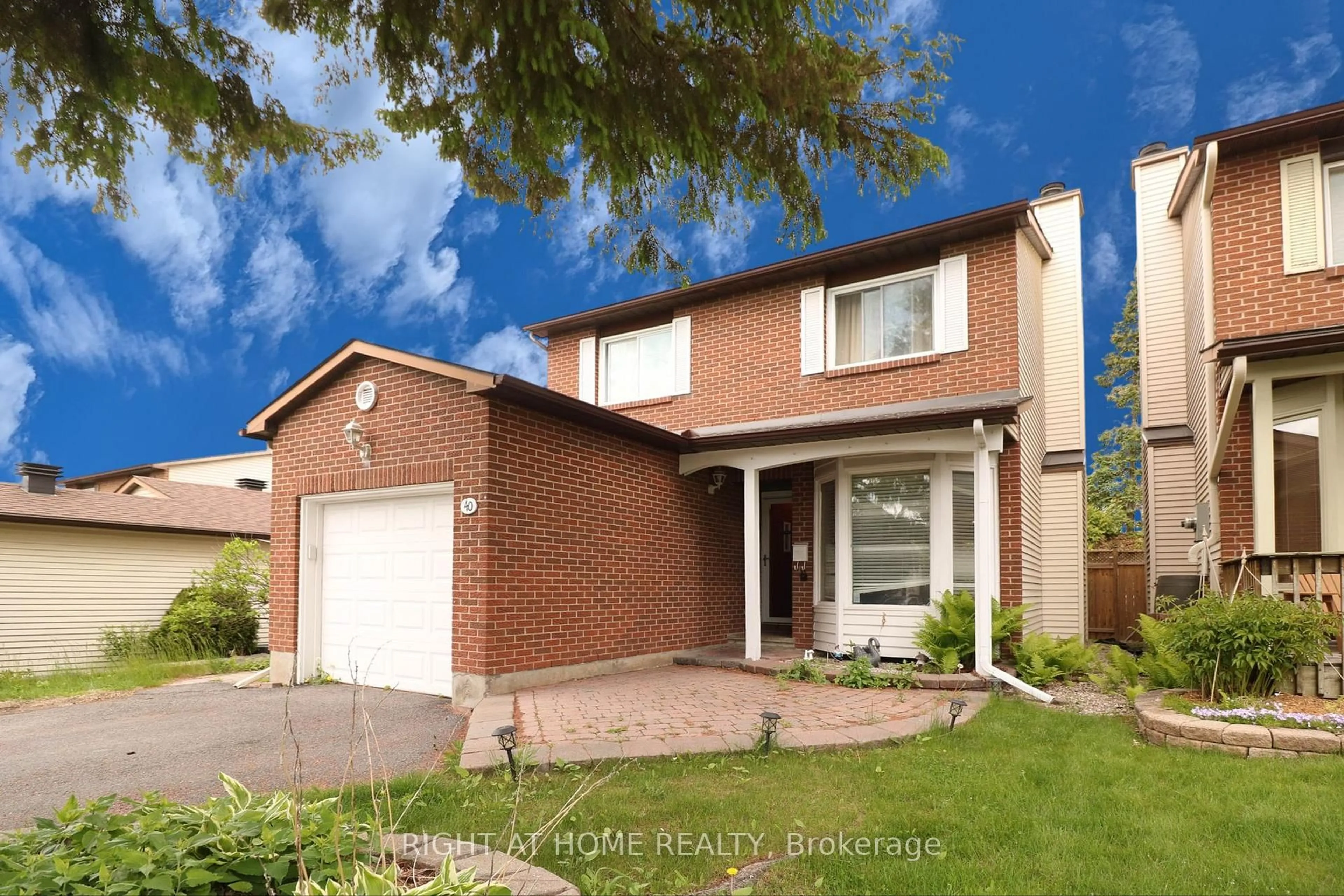 Home with brick exterior material, street for 40 Stable Way, Kanata Ontario K2M 1A6