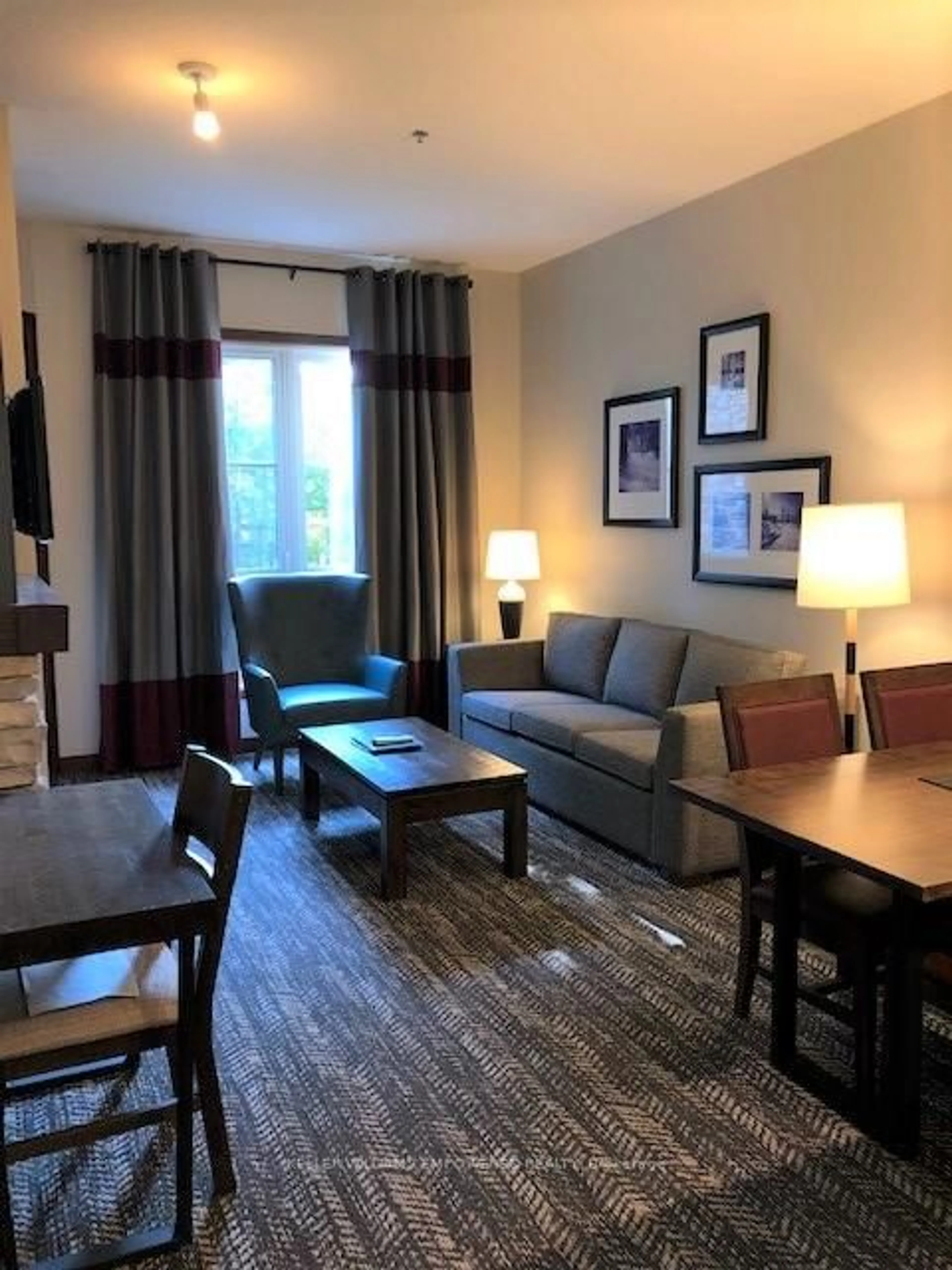 Living room with furniture, wood/laminate floor for 152 Jozo Weider Blvd #132, Blue Mountains Ontario L9Y 0V2