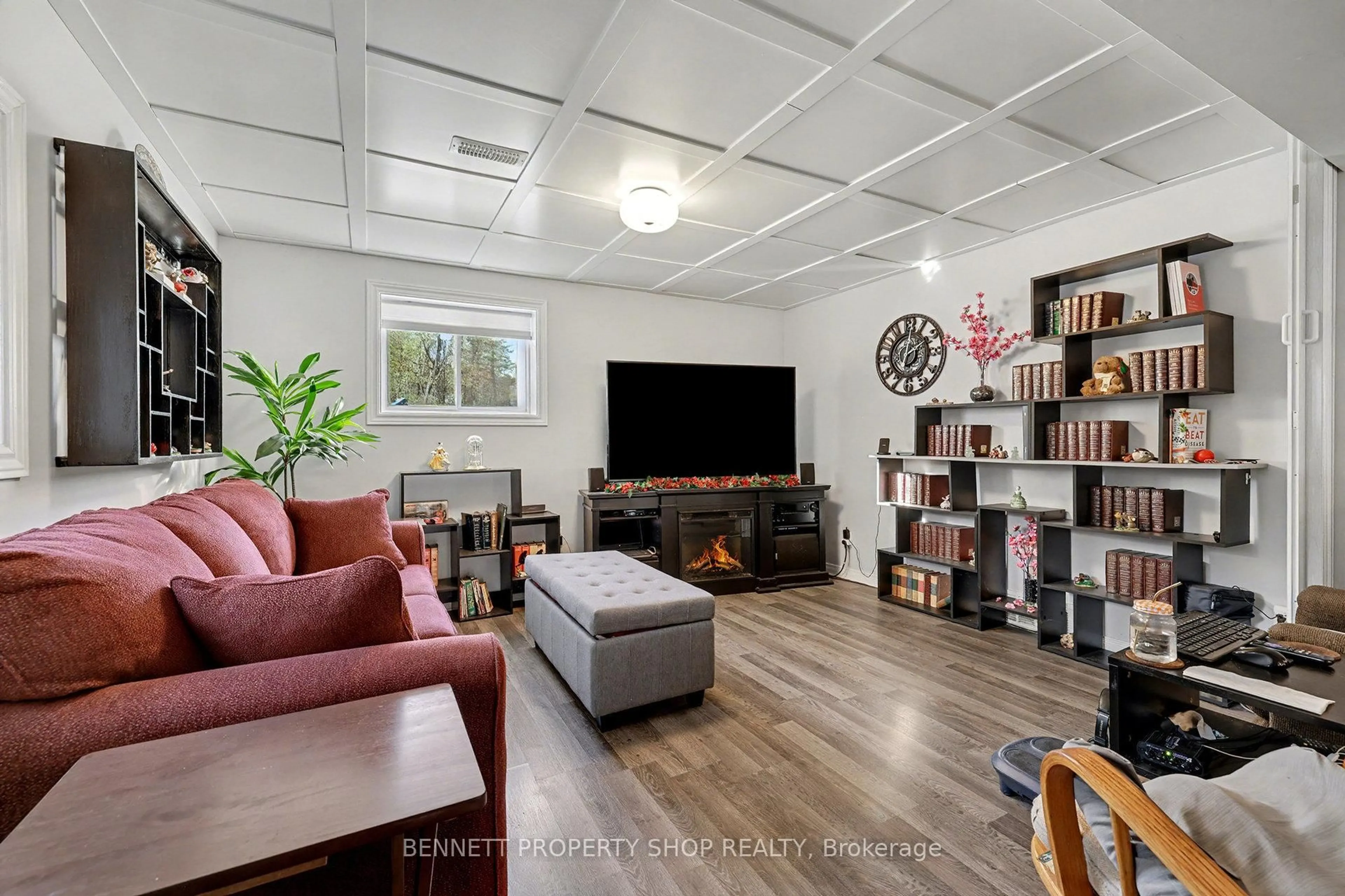 Living room with furniture, wood/laminate floor for 6070 Fourth Line Rd, North Gower Ontario K0A 2T0