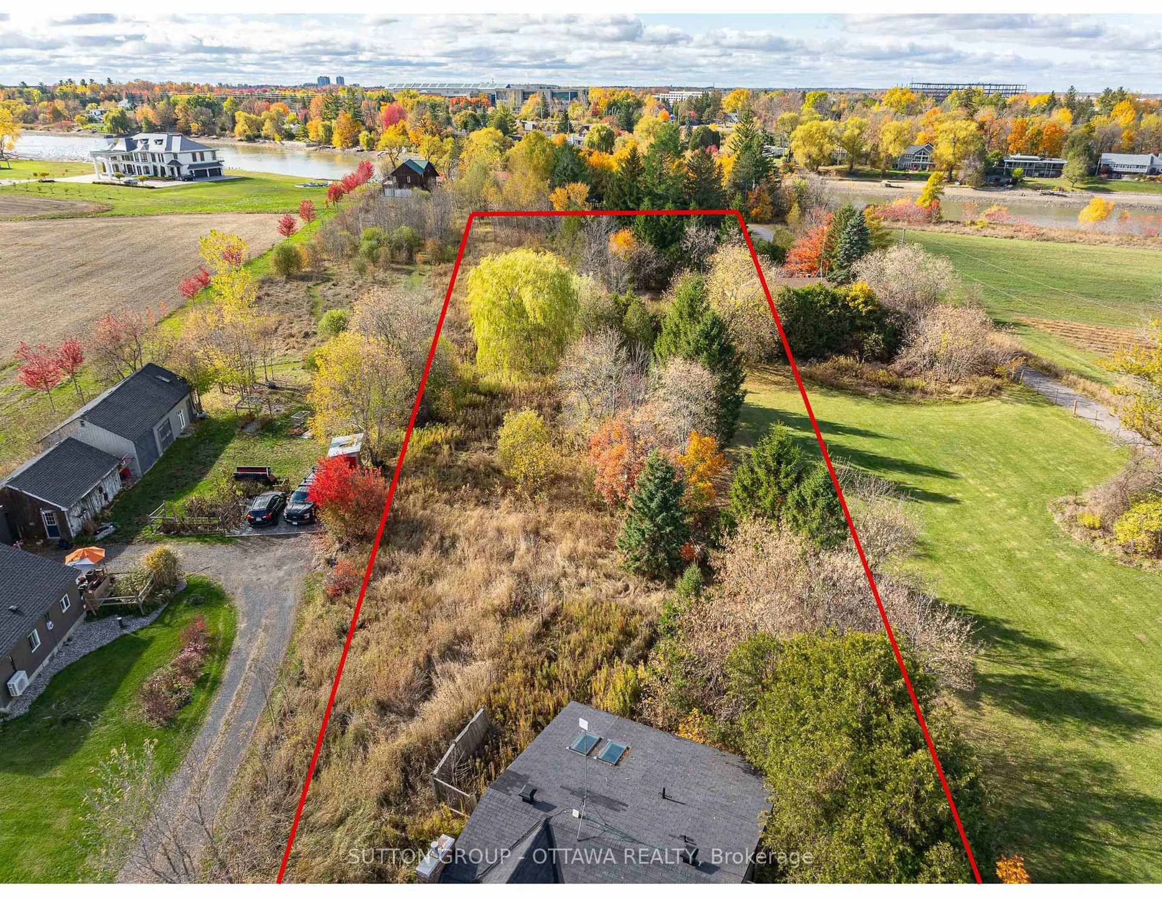 A pic from outside/outdoor area/front of a property/back of a property/a pic from drone, forest/trees view for 458 River Rd, Ottawa Ontario K1V 1E7