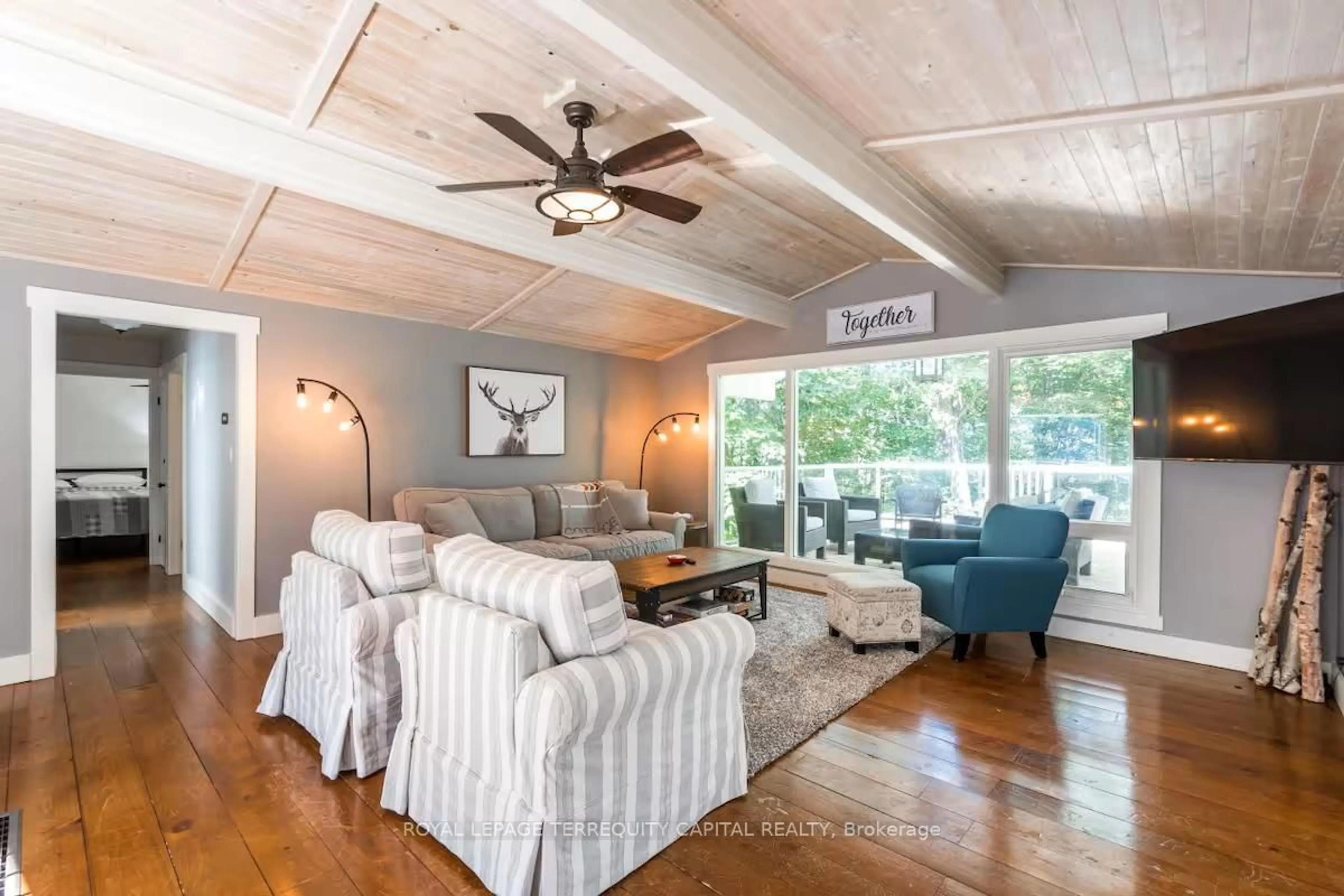 Living room with furniture, wood/laminate floor for 9 Denniss Dr, Bracebridge Ontario P1L 1W9