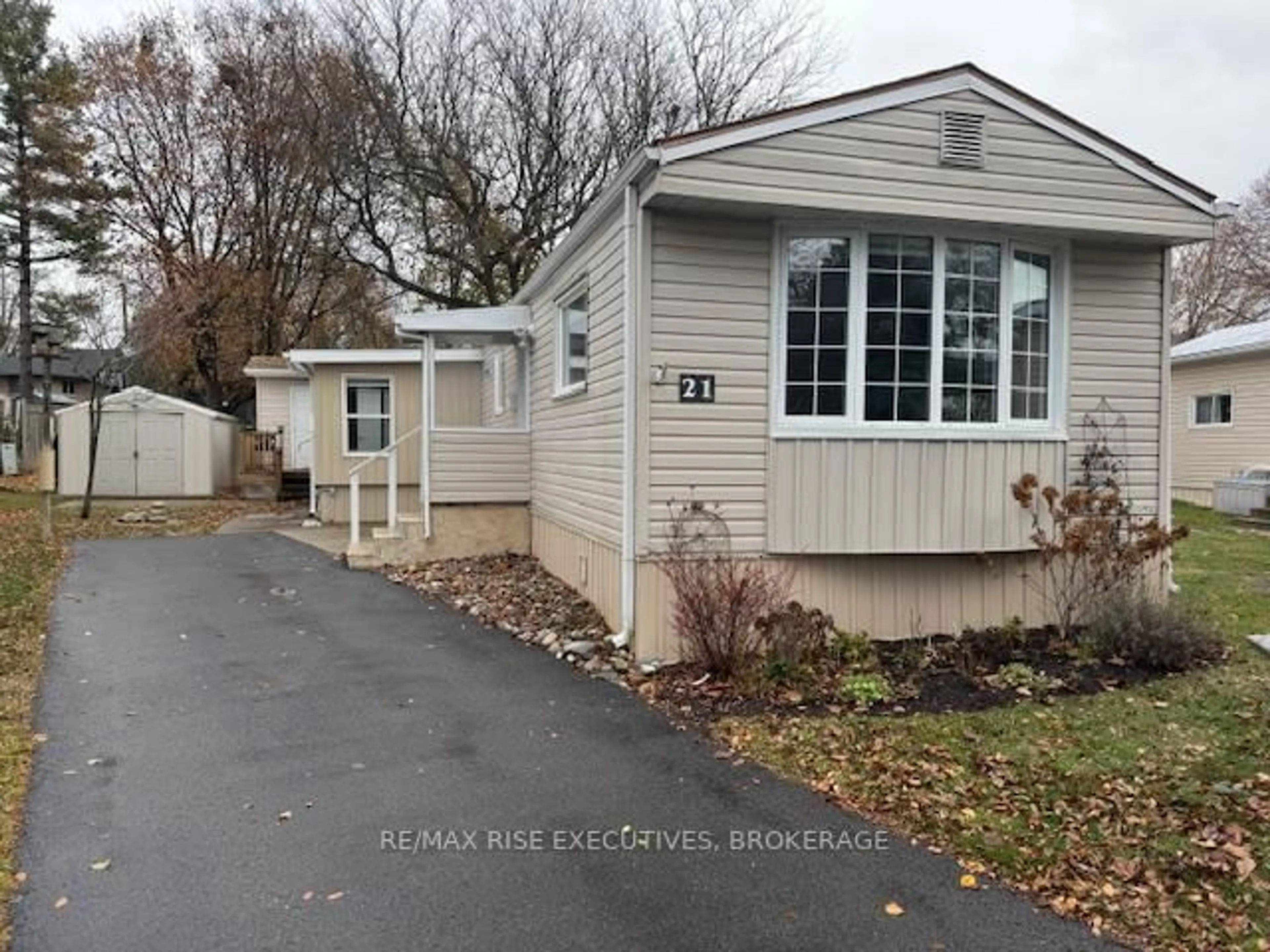 Home with vinyl exterior material, street for 21 Powley Garden Dr, Kingston Ontario K7K 6A2