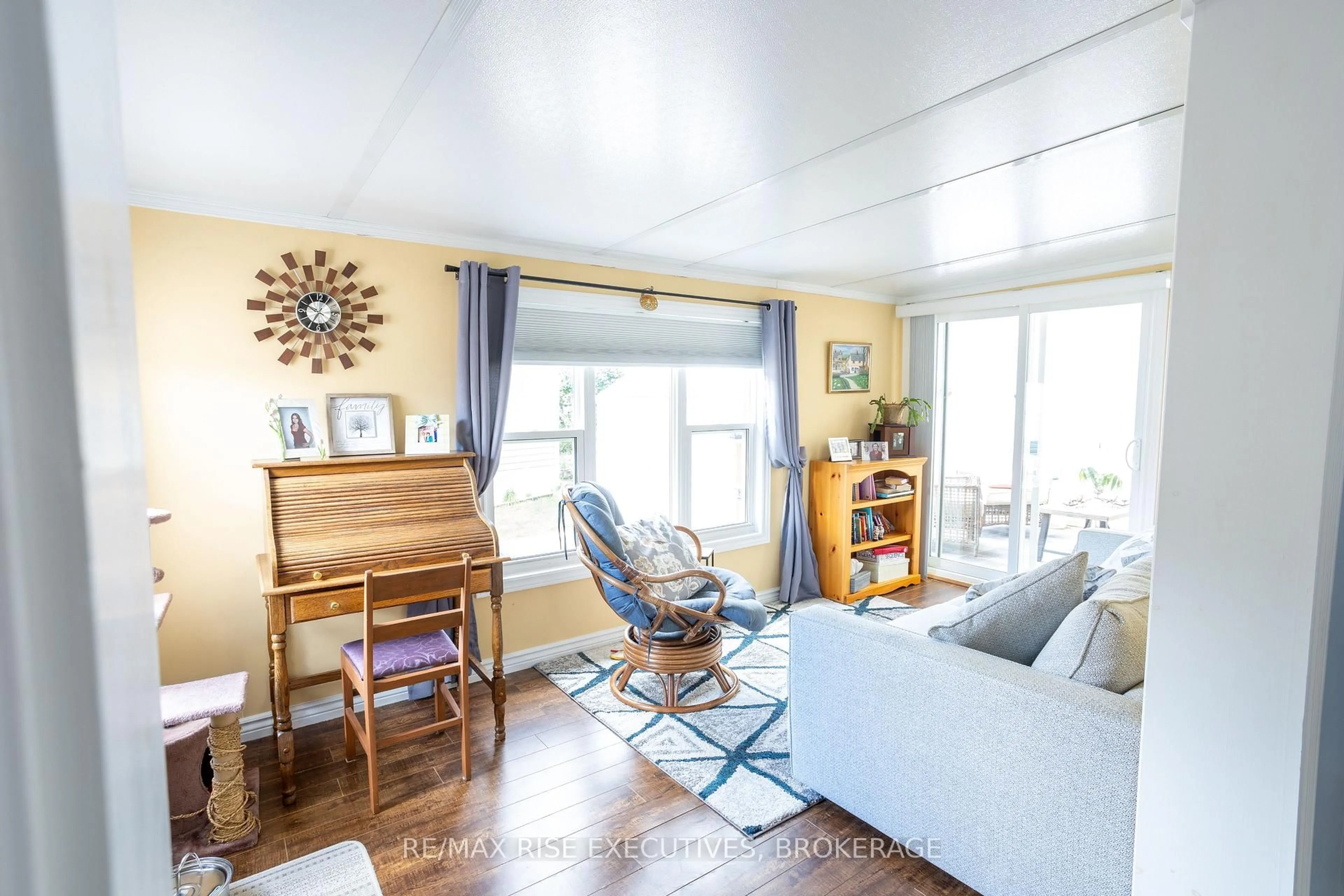 Living room with furniture, wood/laminate floor for 21 Powley Garden Dr, Kingston Ontario K7K 6A2