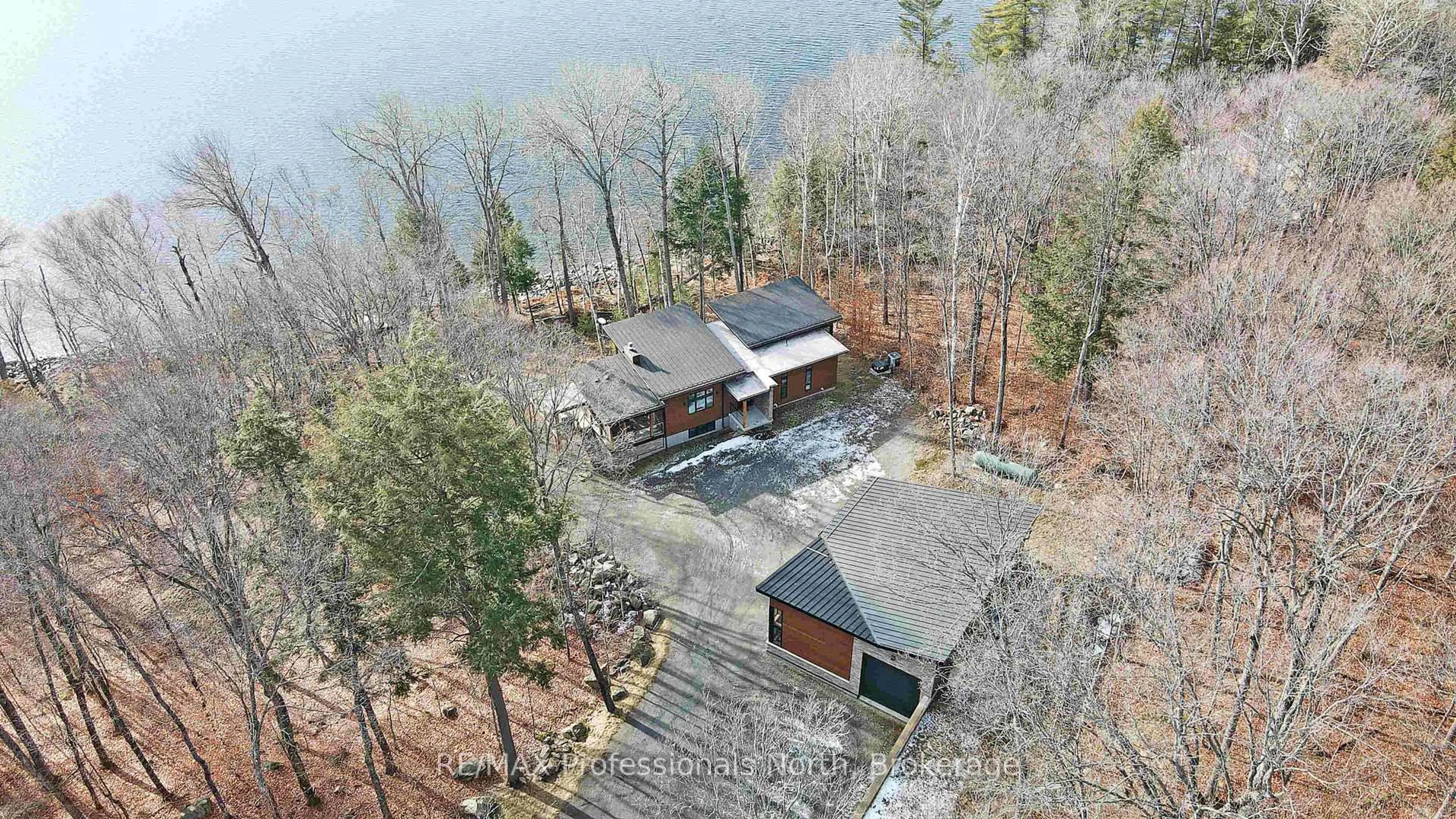 A pic from outside/outdoor area/front of a property/back of a property/a pic from drone, water/lake/river/ocean view for 1237 Burlywood Tr, Dysart et al Ontario K0M 1S0