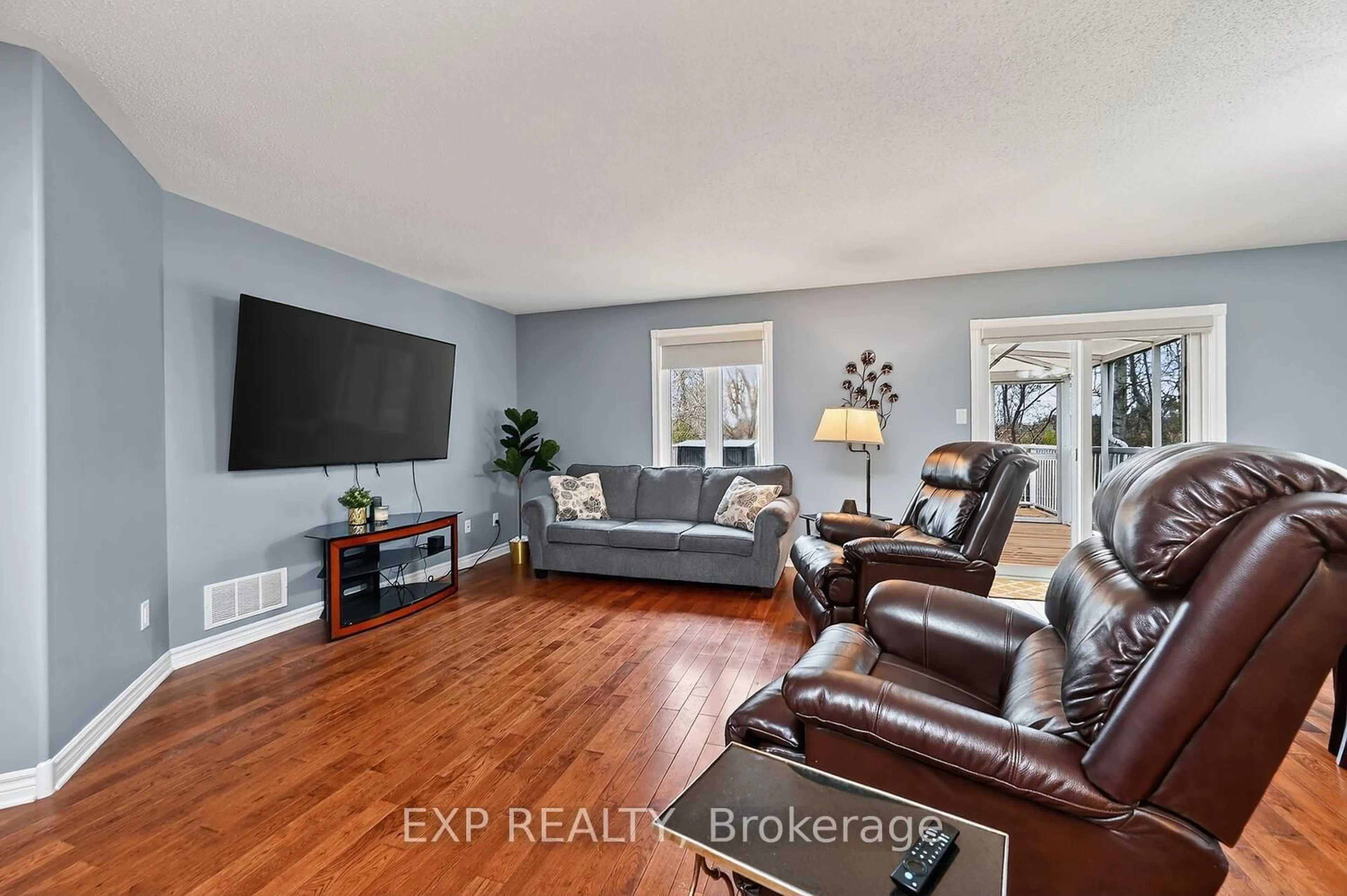 Living room with furniture, wood/laminate floor for 147 Raina Way, North Grenville Ontario K0G 1J0
