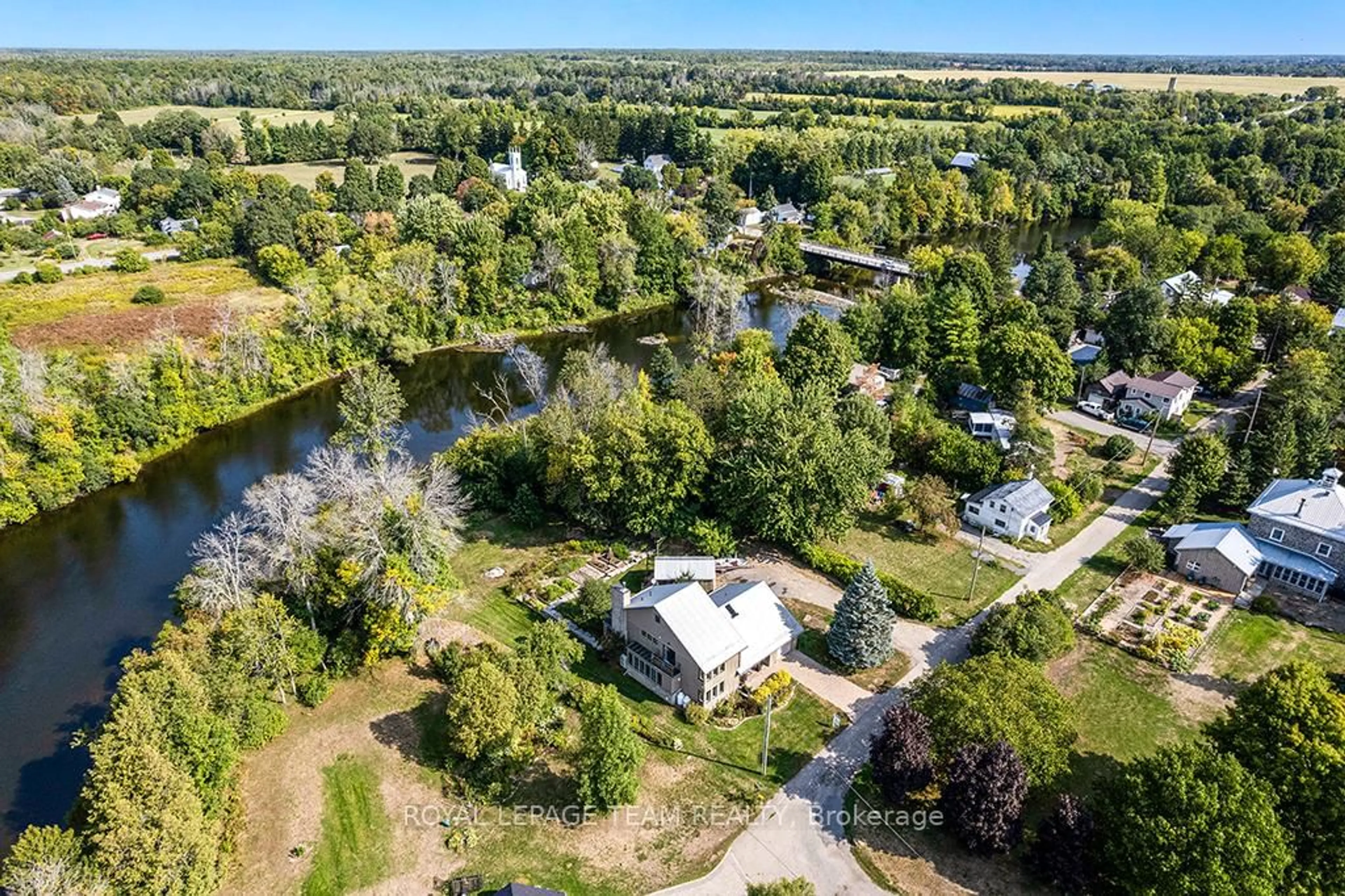 A pic from outside/outdoor area/front of a property/back of a property/a pic from drone, water/lake/river/ocean view for 3 Mary St, North Grenville Ontario K0G 1B0
