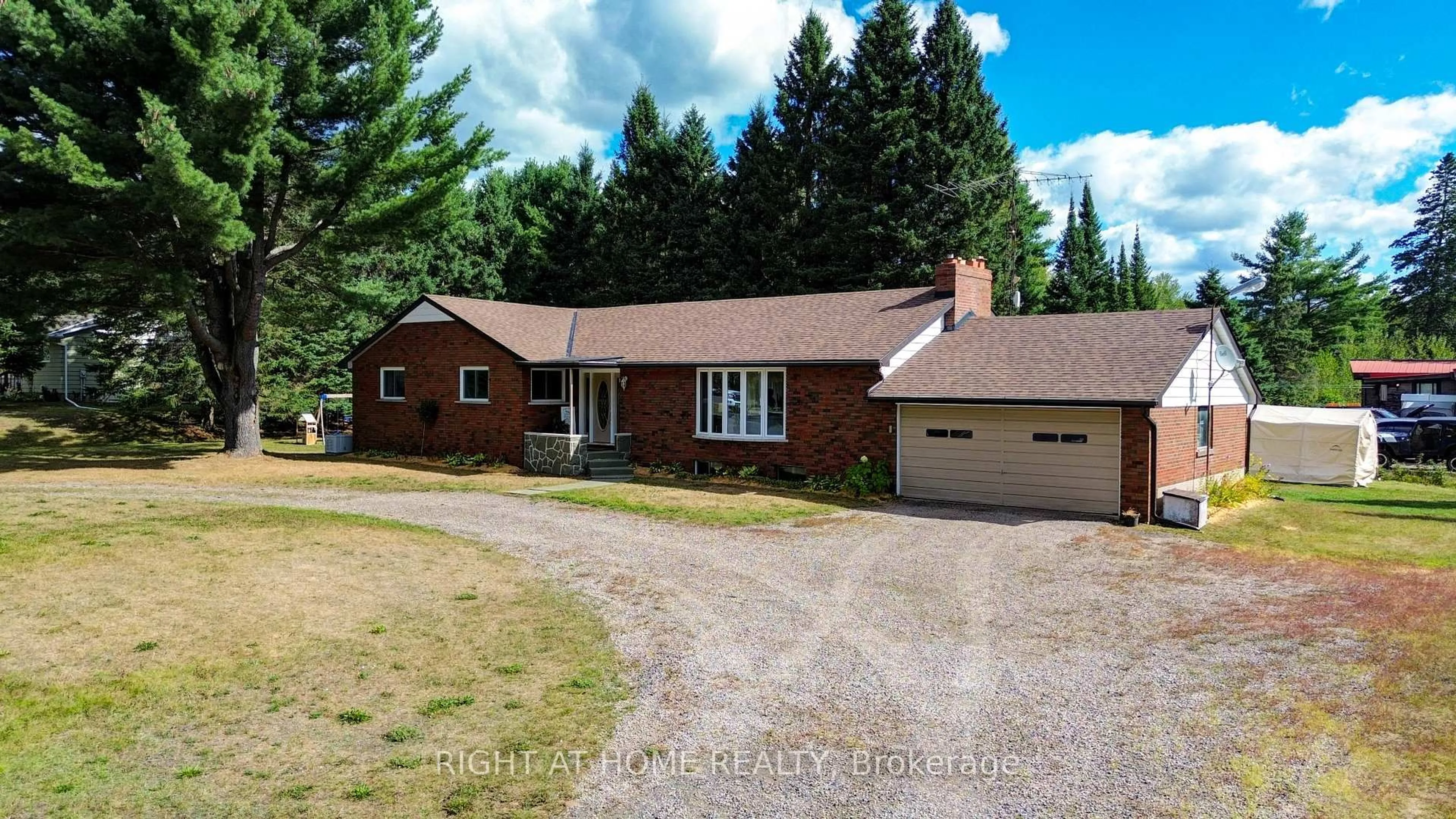 A pic from outside/outdoor area/front of a property/back of a property/a pic from drone, street for 1012 Clement Lake Rd, Highlands East Ontario K0L 3C0