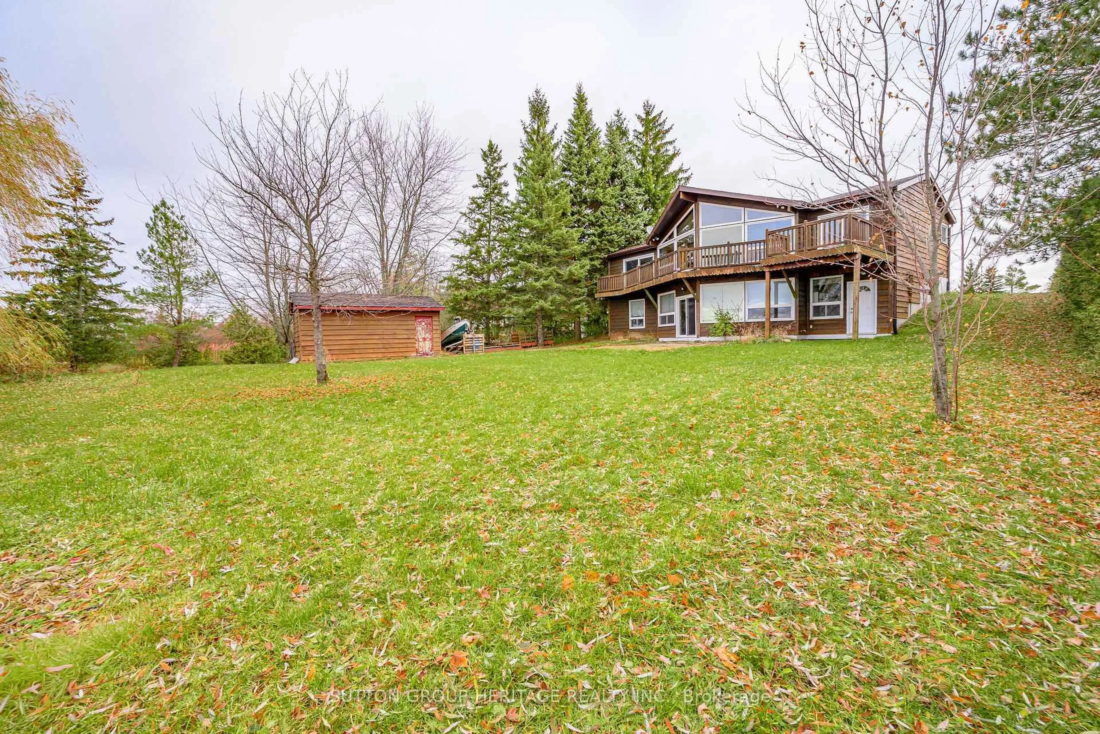 A pic from outside/outdoor area/front of a property/back of a property/a pic from drone, water/lake/river/ocean view for 24 Pleasant View Cres, Kawartha Lakes Ontario K0M 2C0