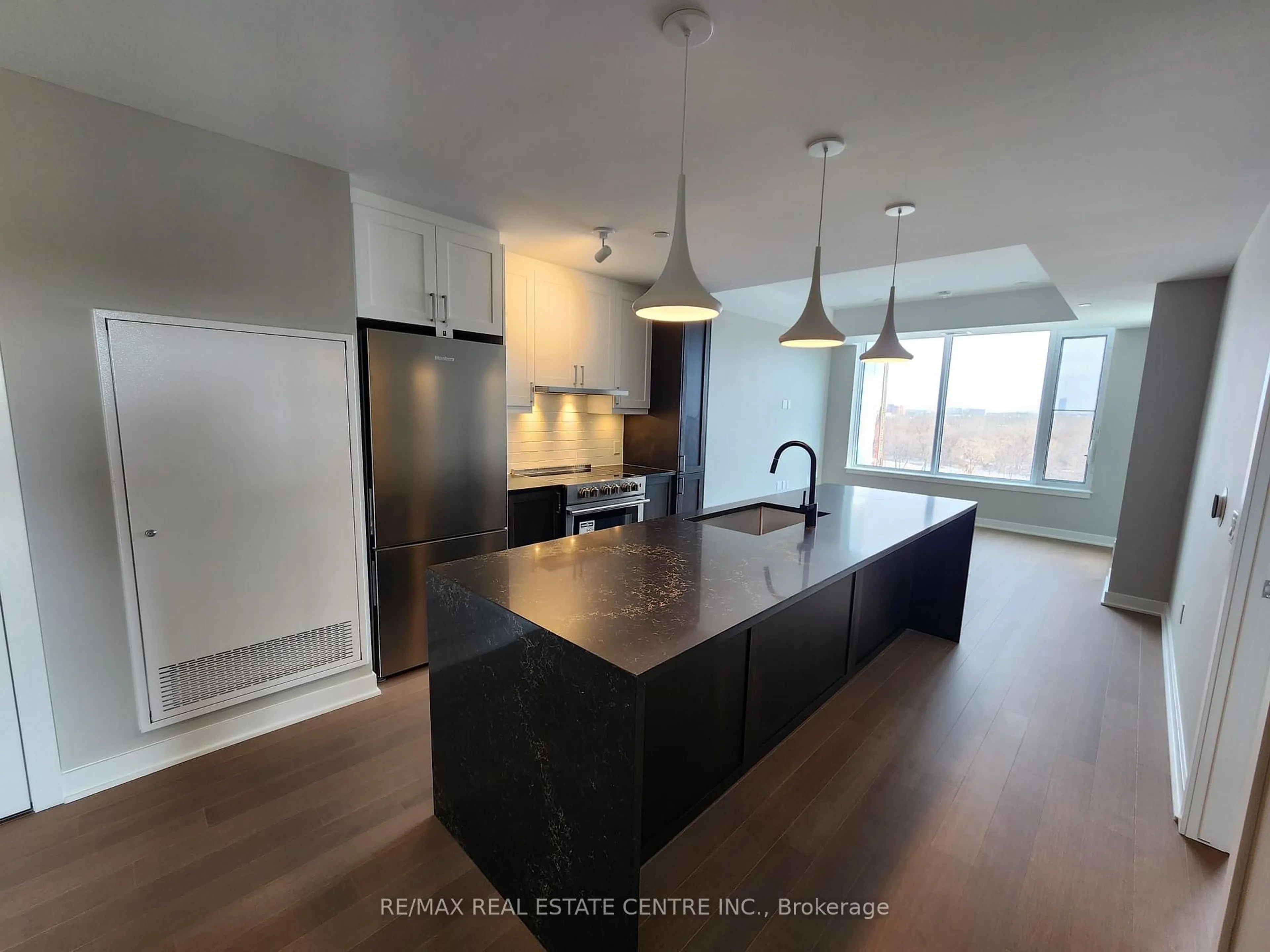 Open concept kitchen, wood/laminate floor for 360 DESCHATELETS Ave #608, Ottawa Ontario K1S 1C3