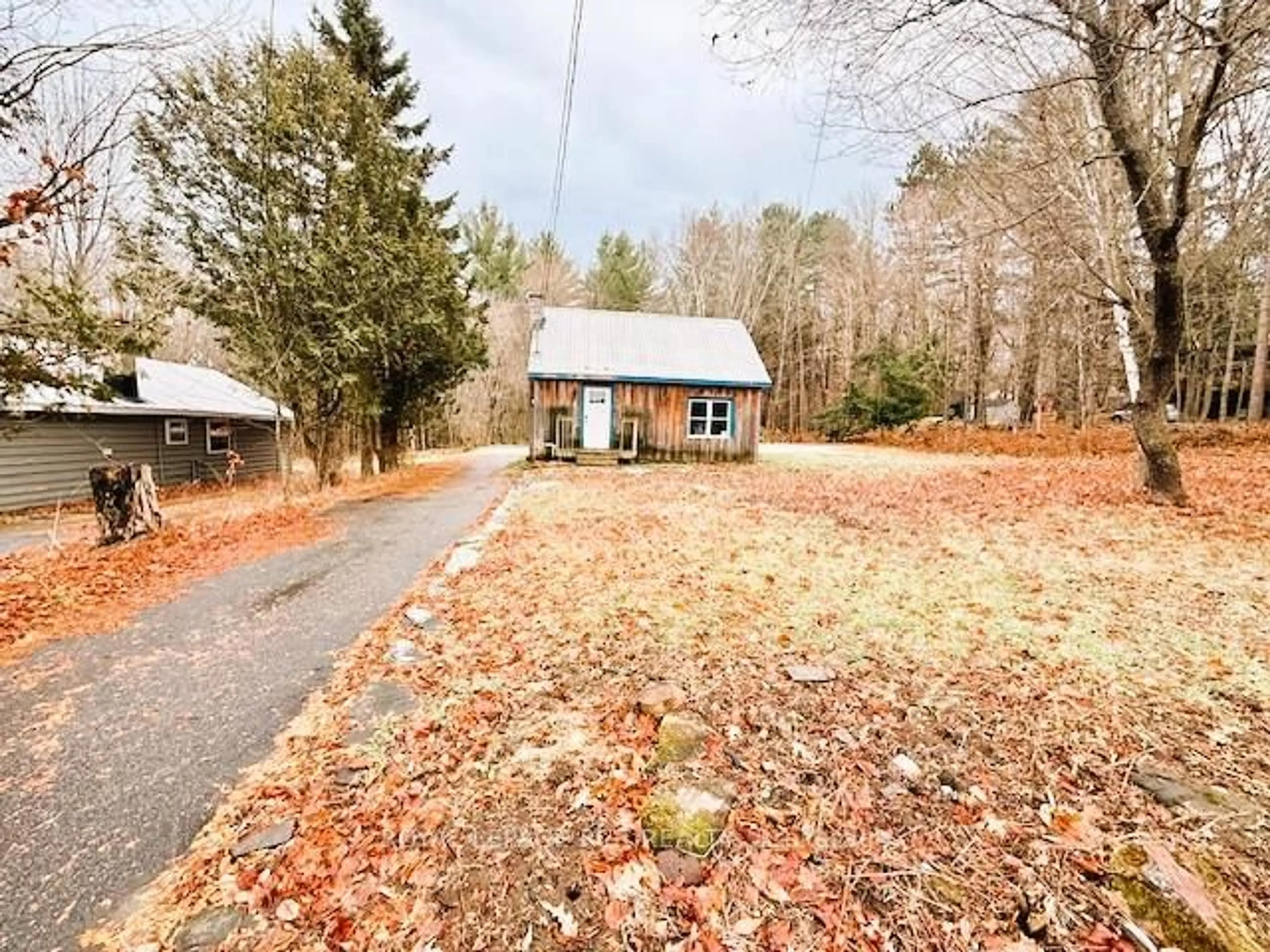 A pic from outside/outdoor area/front of a property/back of a property/a pic from drone, unknown for 89 TOWN LINE Rd, Huntsville Ontario P1H 1S6