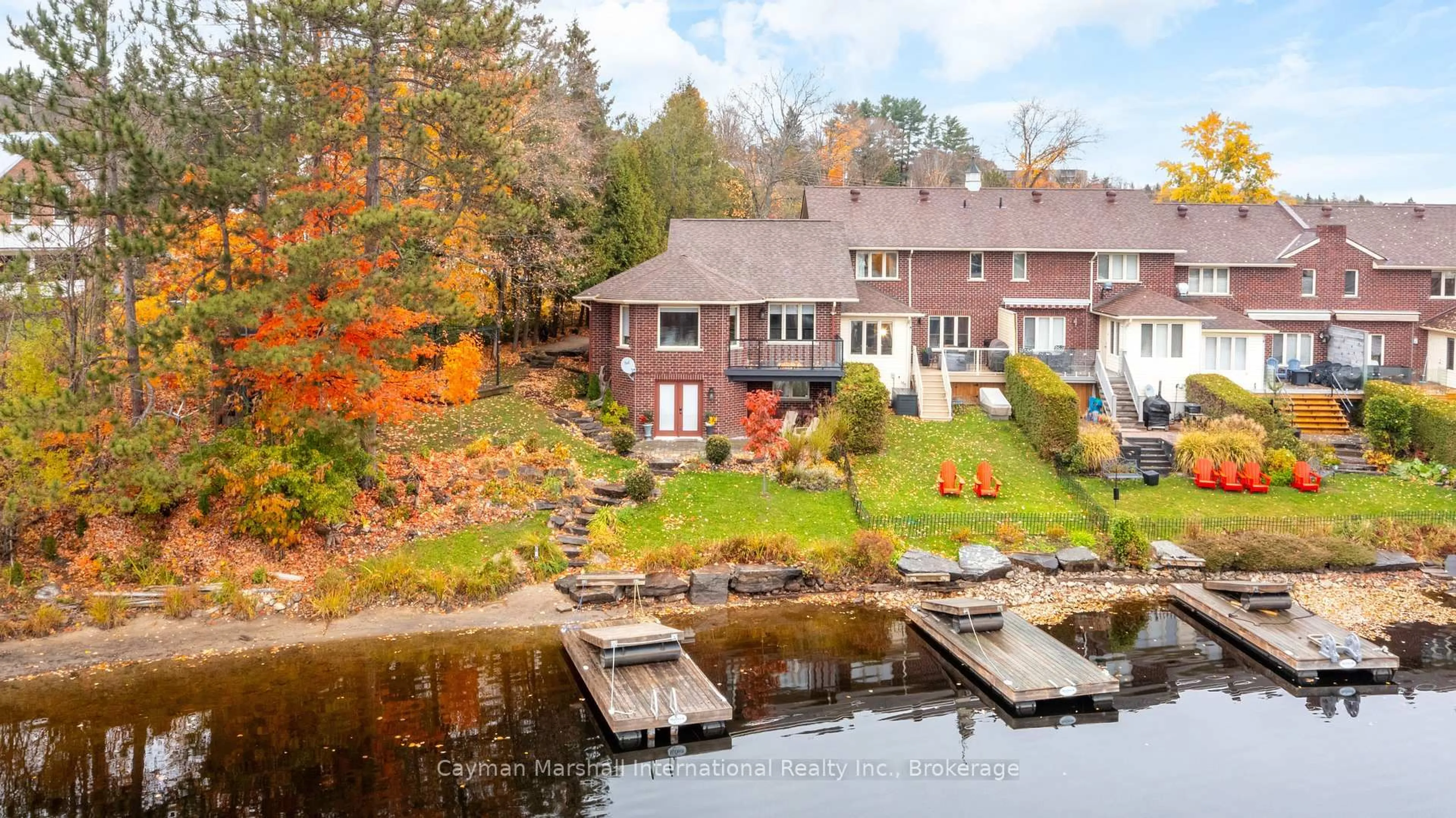 A pic from outside/outdoor area/front of a property/back of a property/a pic from drone, water/lake/river/ocean view for 27 John St, Huntsville Ontario P1H 1H2