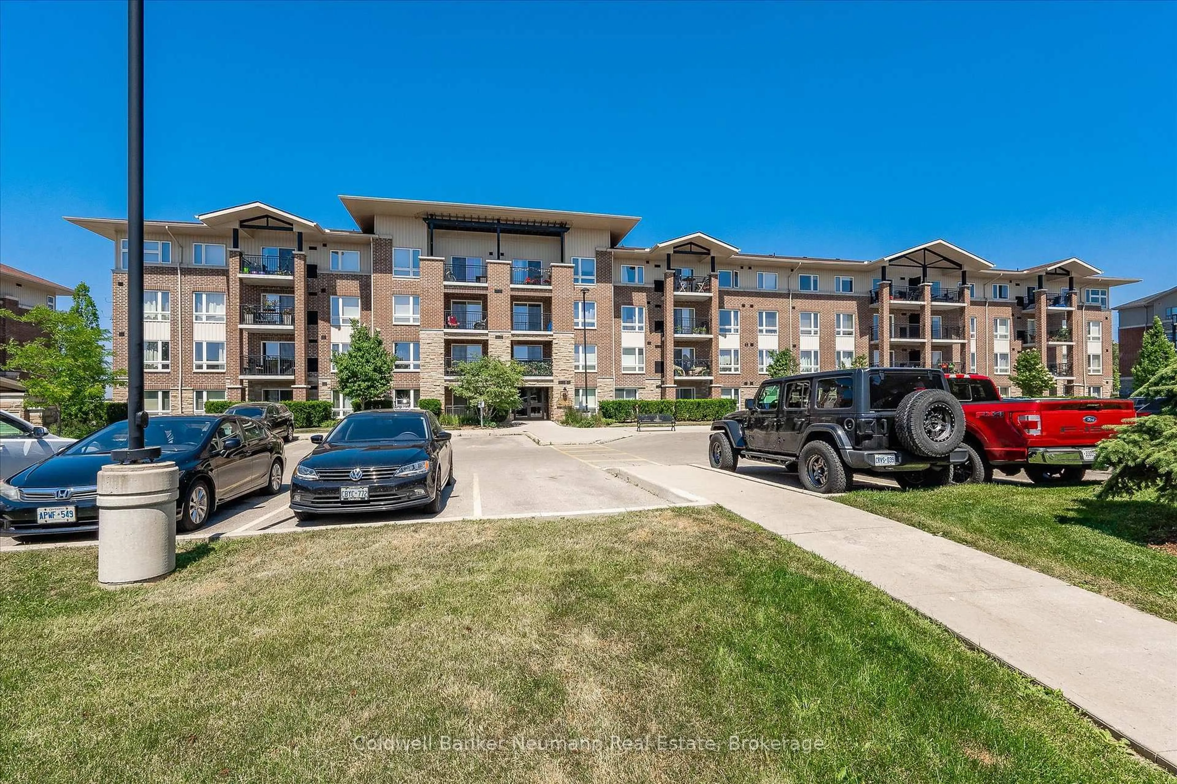 A pic from outside/outdoor area/front of a property/back of a property/a pic from drone, unknown for 45 Kingsbury Sq #406, Guelph Ontario N1L 0L2