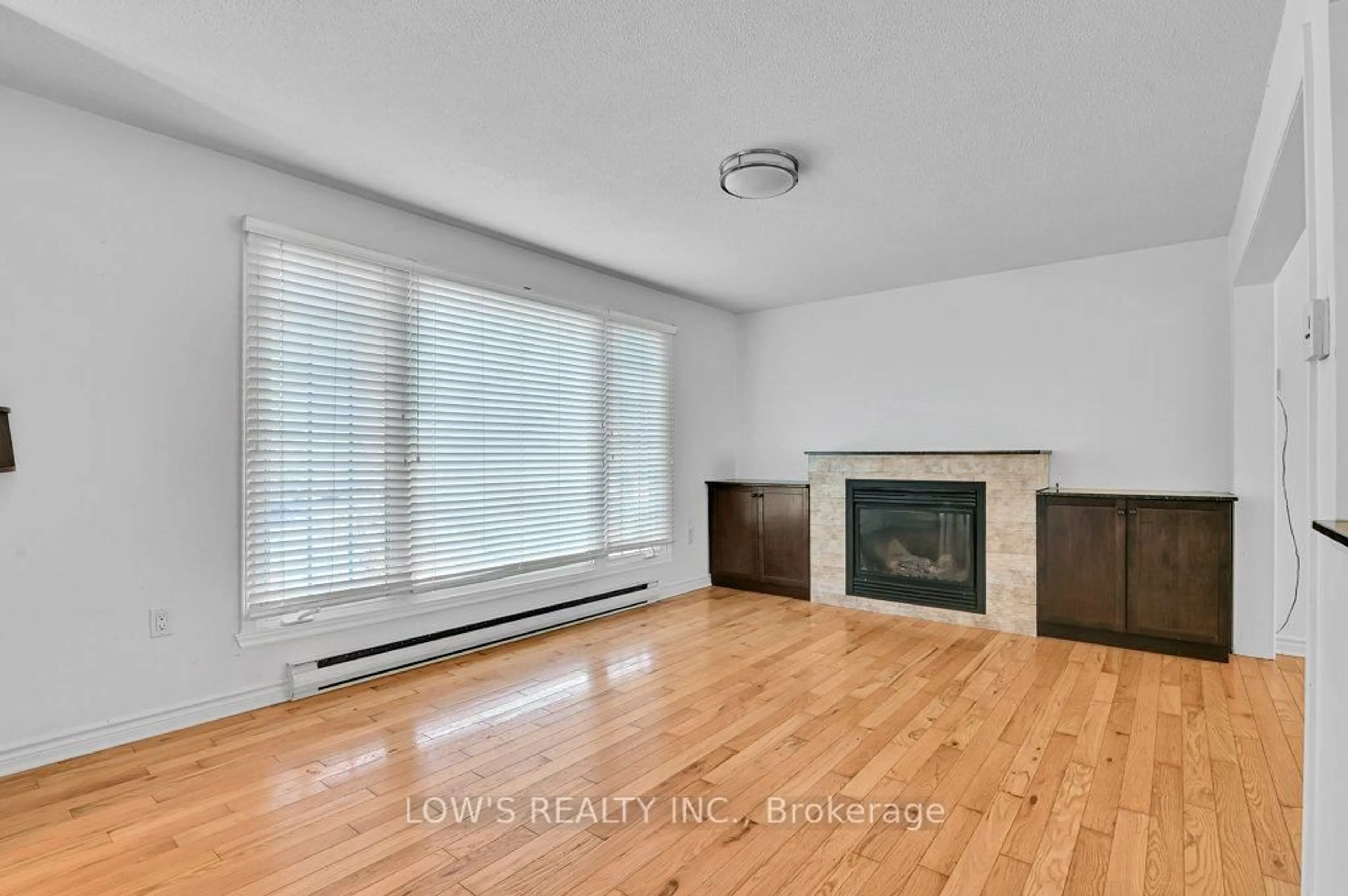 Living room with furniture, wood/laminate floor for 113 Barton St, Champlain Ontario K0B 1R0