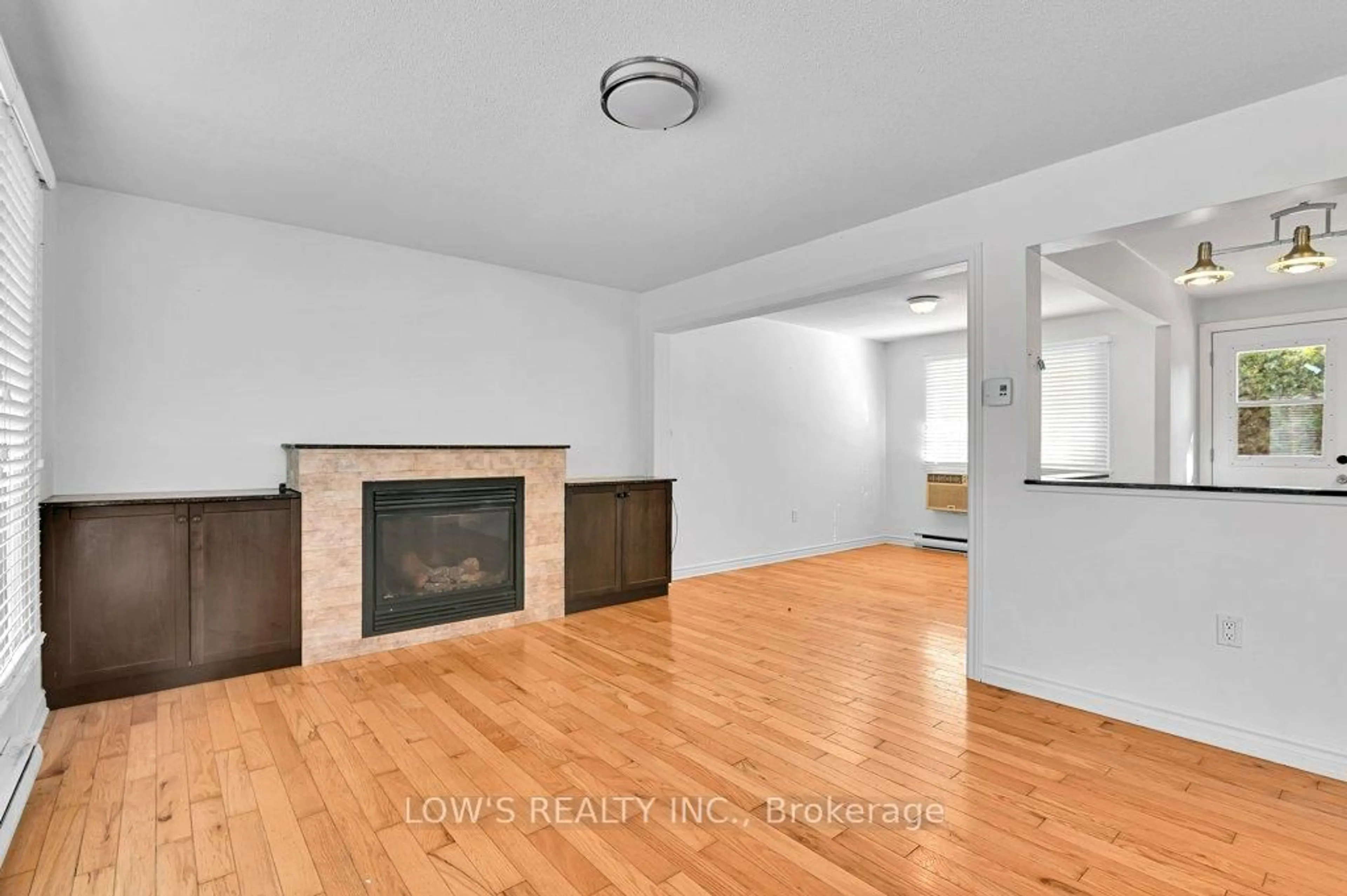 Living room with furniture, wood/laminate floor for 113 Barton St, Champlain Ontario K0B 1R0