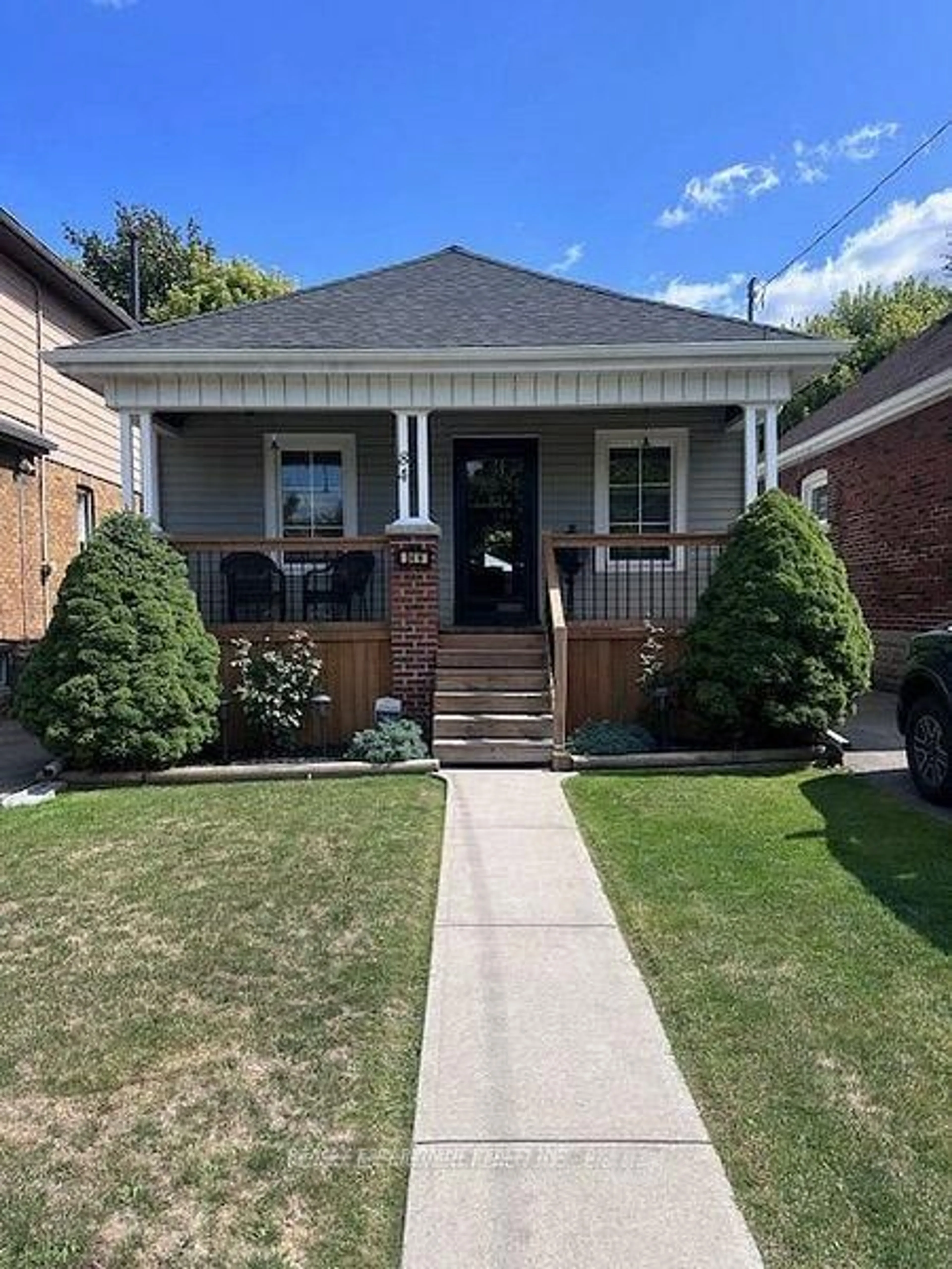 Home with brick exterior material, street for 84 Barons Ave, Hamilton Ontario L8H 5A4