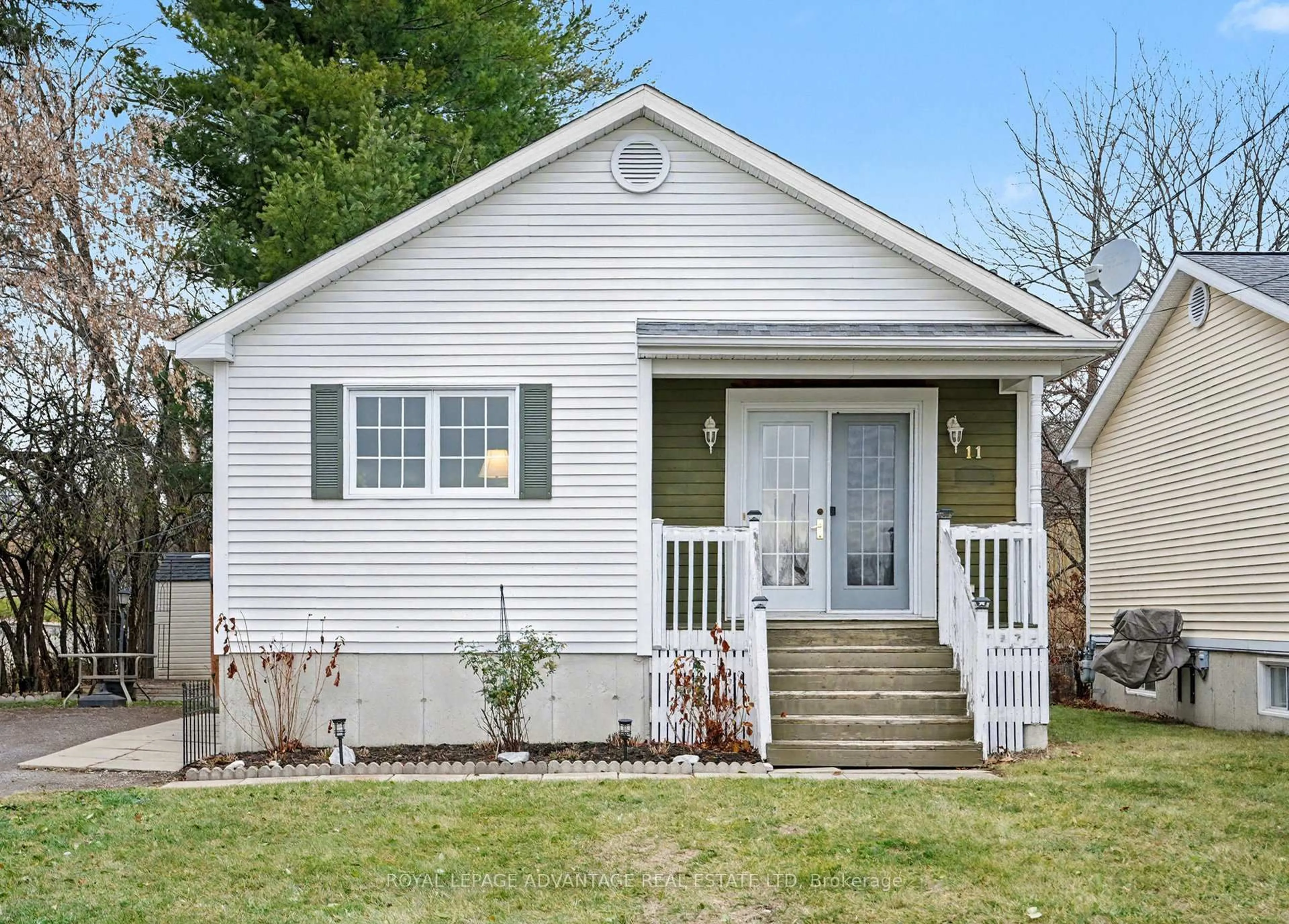 Home with vinyl exterior material, street for 11 Queen St, Perth Ontario K7H 2W4