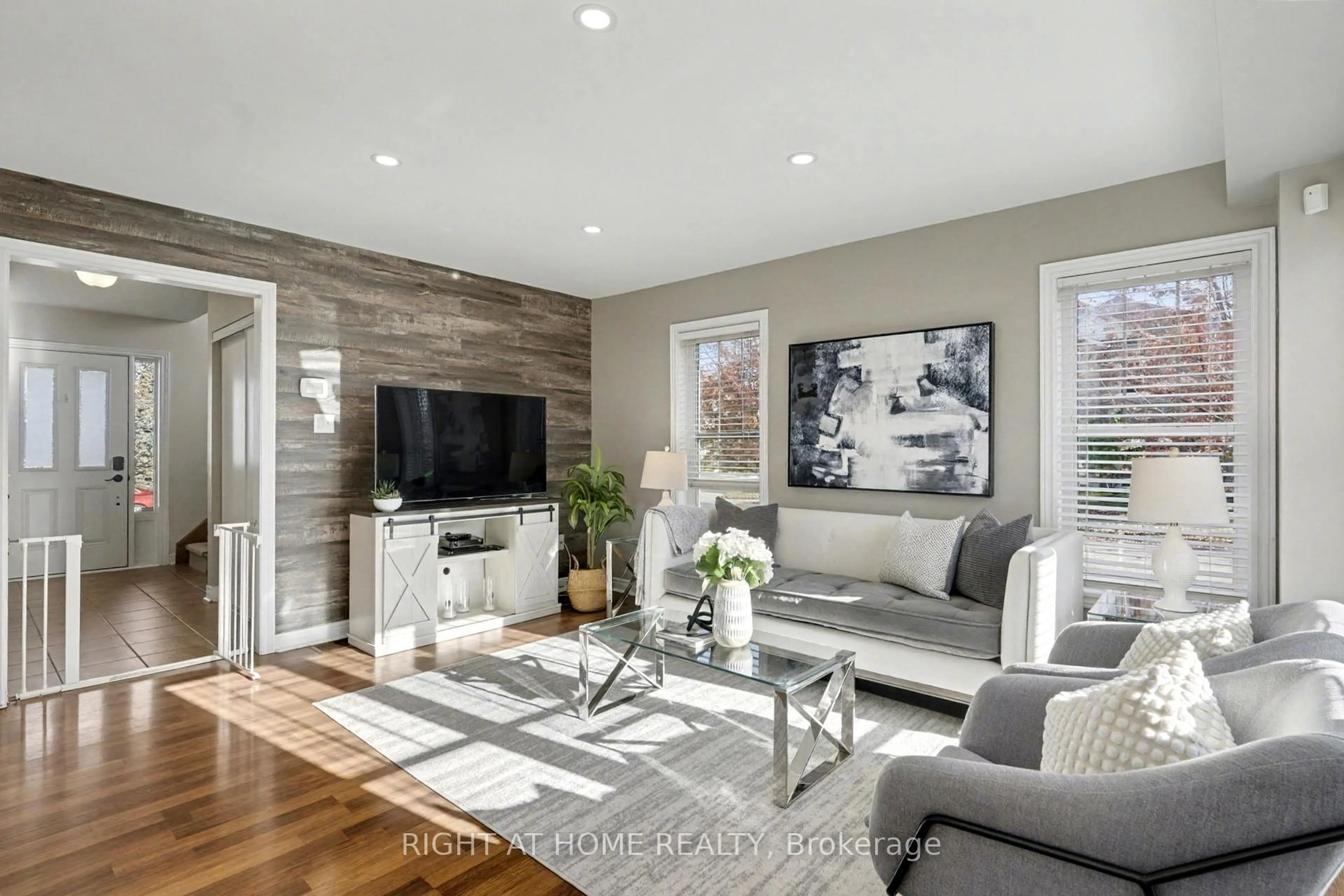 Living room with furniture, wood/laminate floor for 88 Buttercup Cres, Hamilton Ontario L8B 0Y1