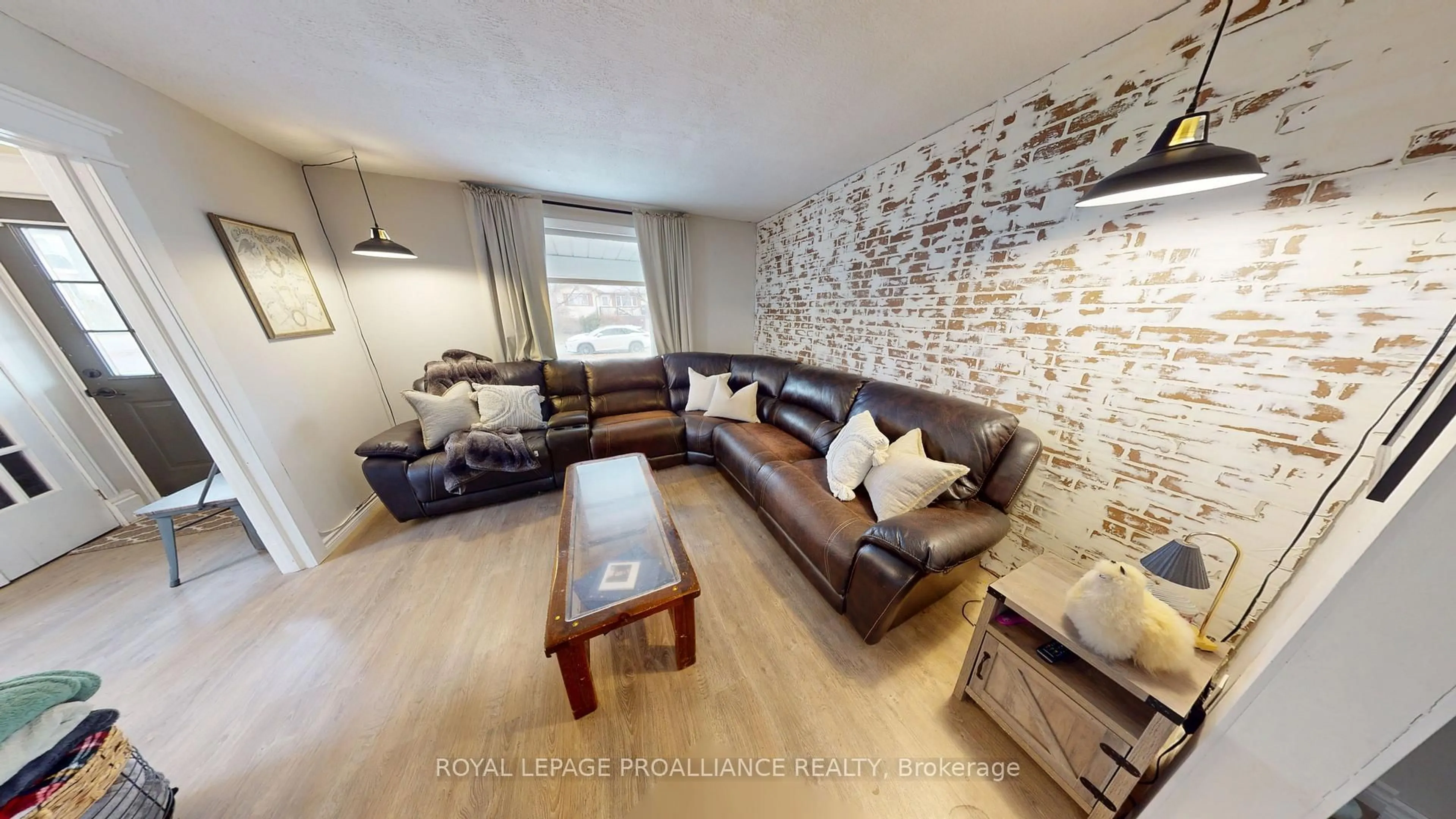 Living room with furniture, wood/laminate floor for 32 McNichol Ave, Quinte West Ontario K8V 2R6