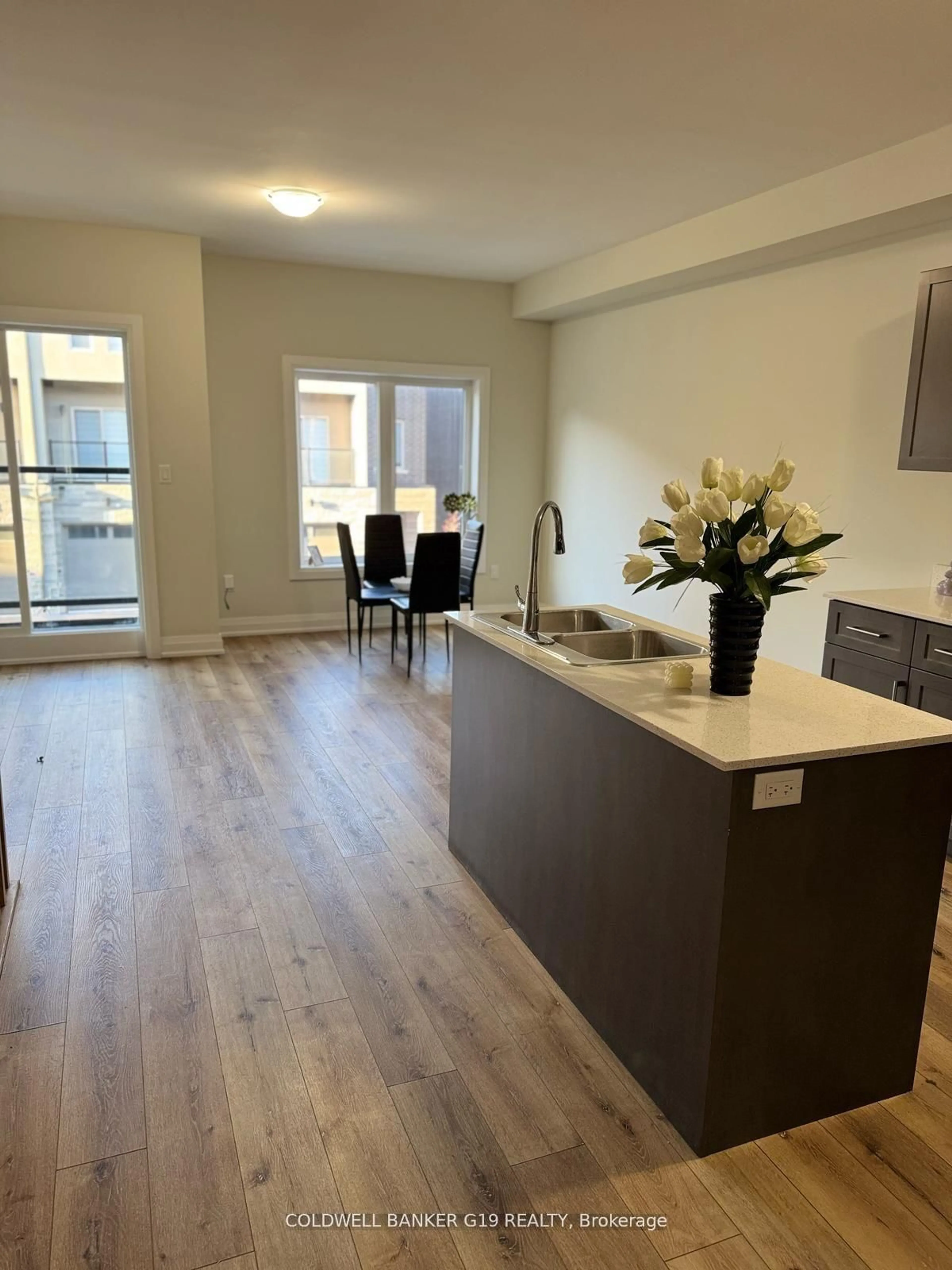 Open concept kitchen, wood/laminate floor for 12 Raspberry Lane, Hamilton Ontario L0R 1W0