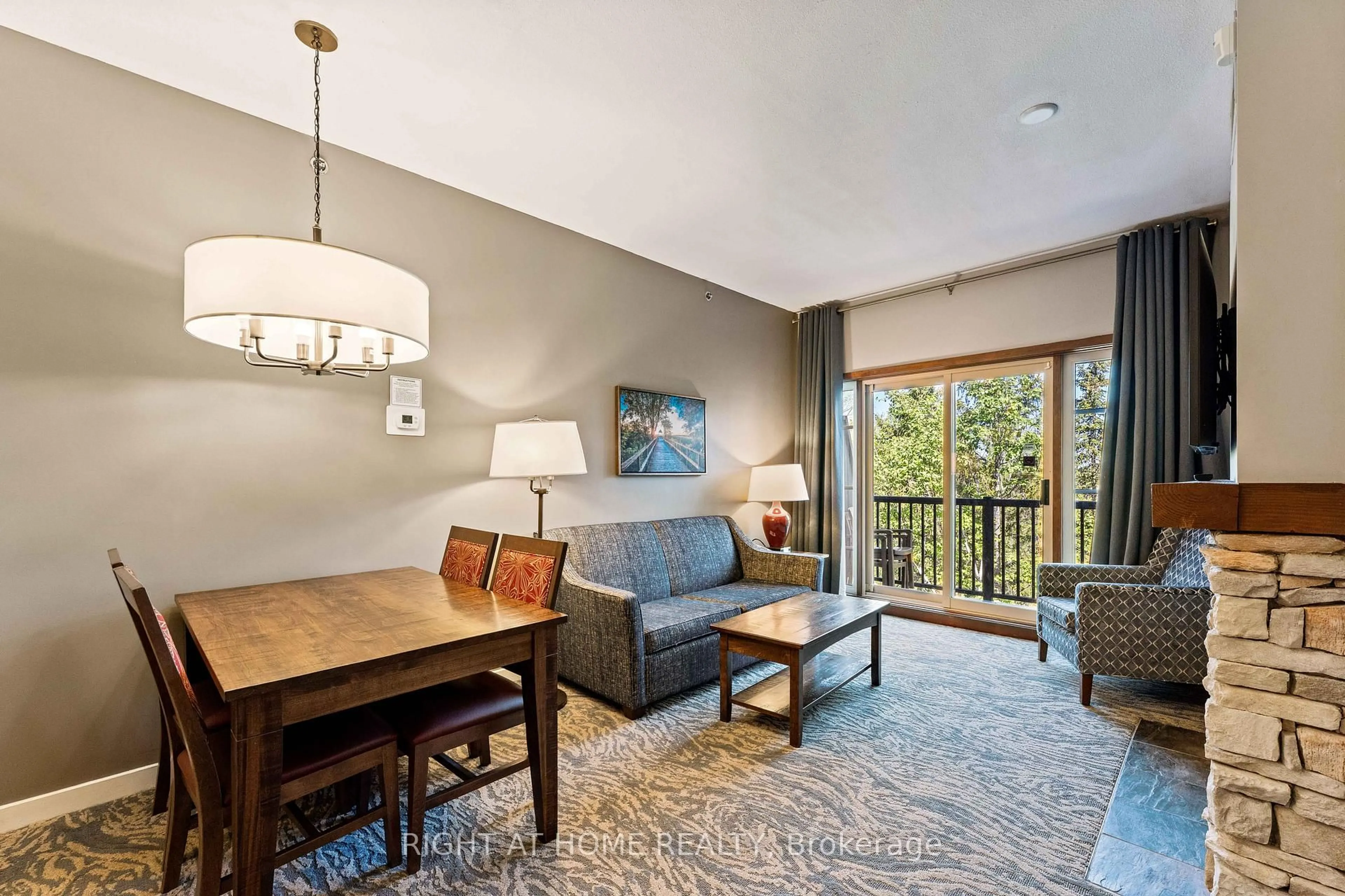 Living room with furniture, wood/laminate floor for 156 Jozo Weider Blvd #437, Blue Mountains Ontario L9Y 0V2