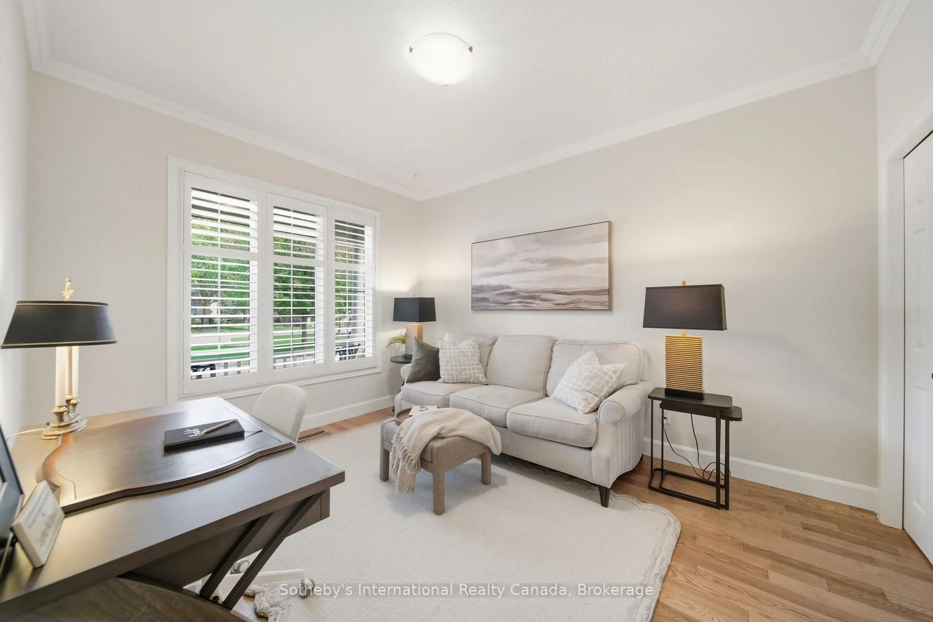 Living room with furniture, wood/laminate floor for 21 St Johns Dr #6, Middlesex Centre Ontario N0M 1C0